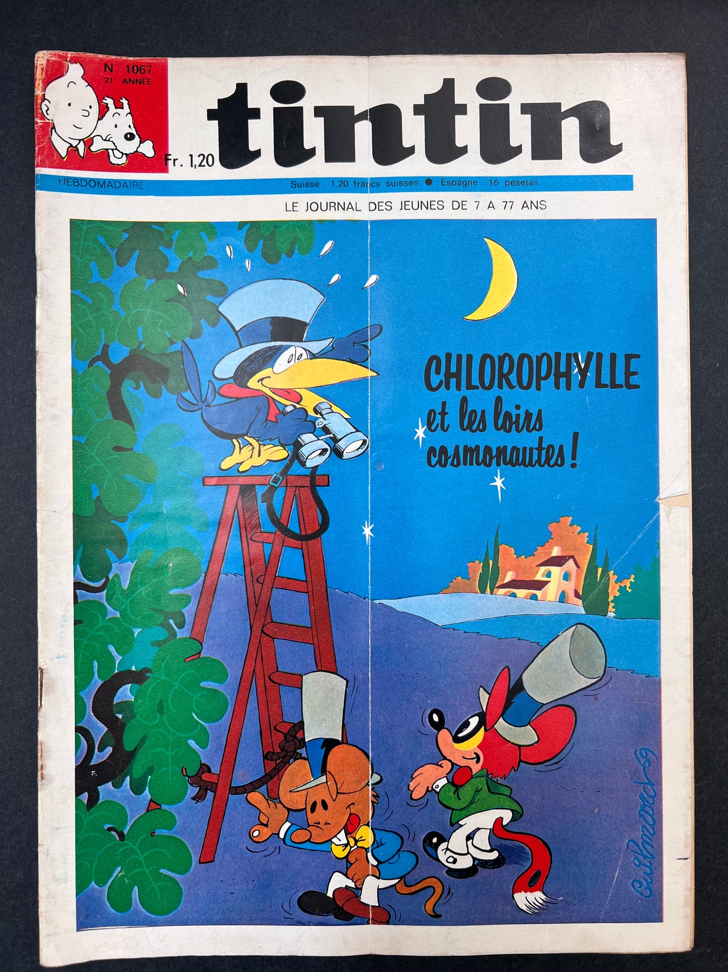 Vintage Tintin comic book cover with cartoon characters and text