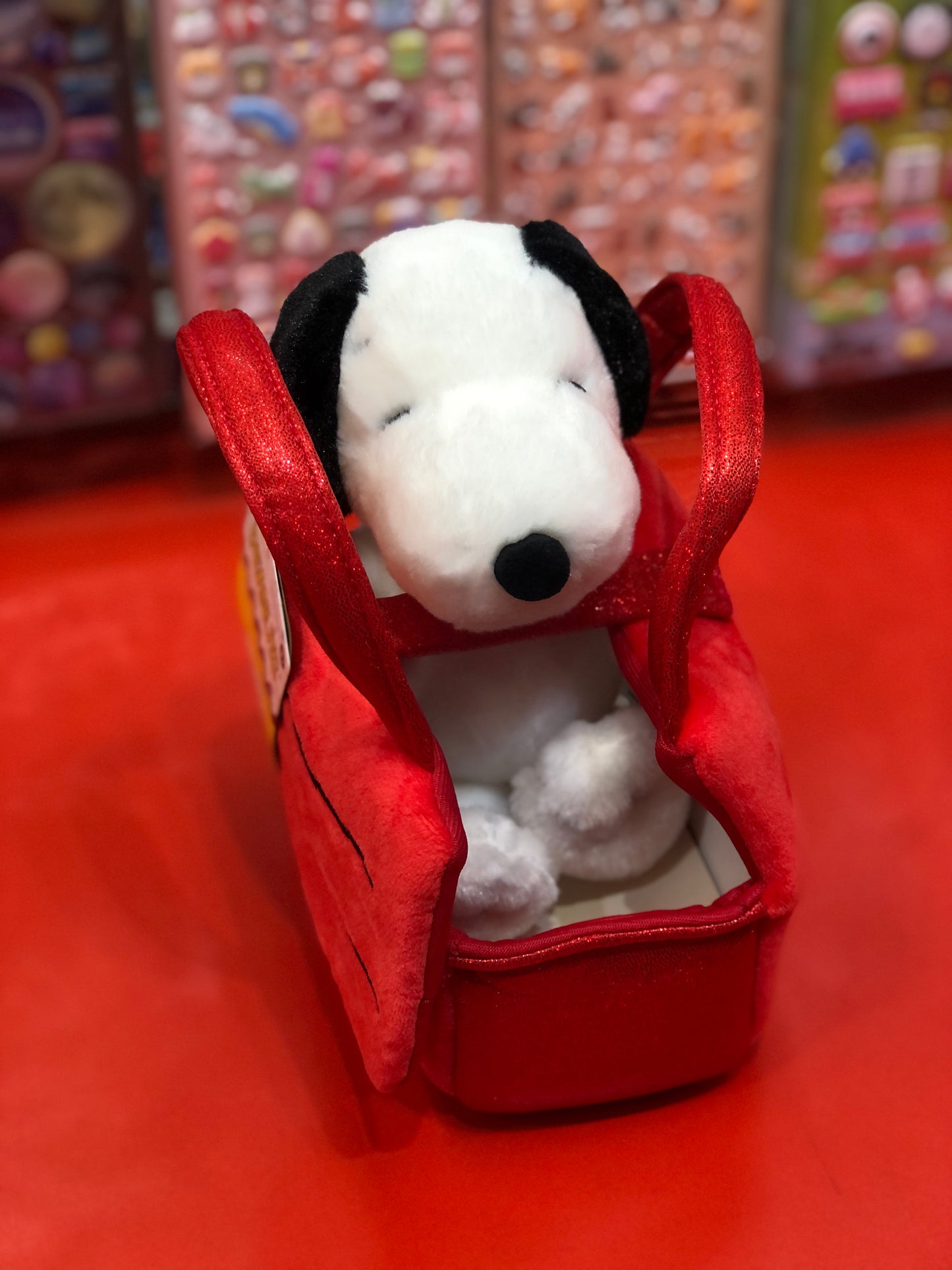 Peanuts Snoopy plush toy in red doghouse, Aurora Fancy Pal collection, soft and huggable, displayed on red surface