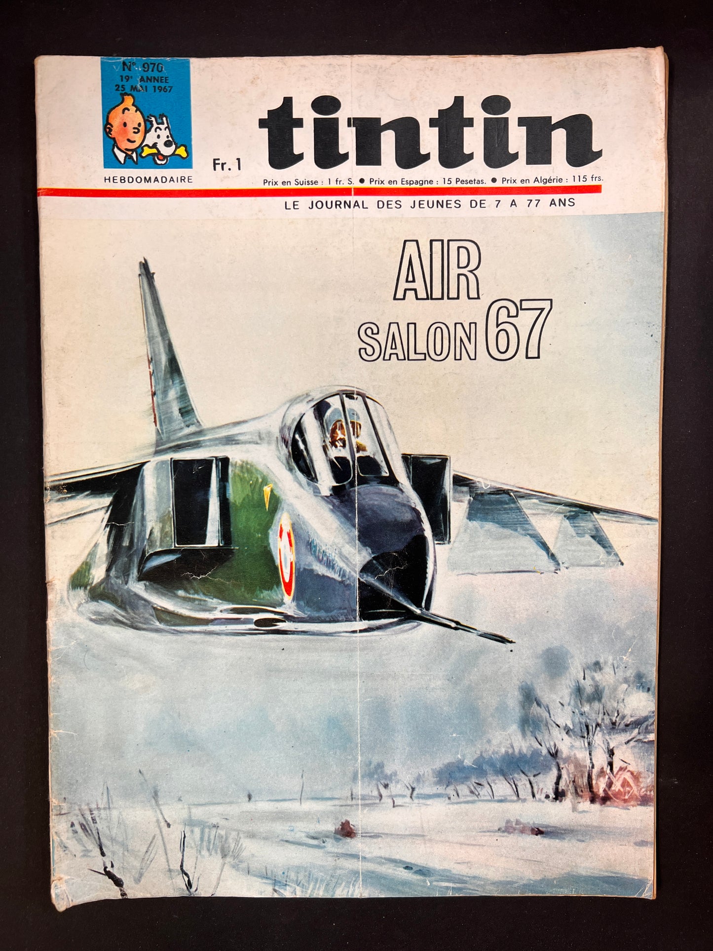 Vintage Tintin magazine cover featuring fighter jet illustration for 'Air Salon 67' over snowy landscape, May 1967 issue