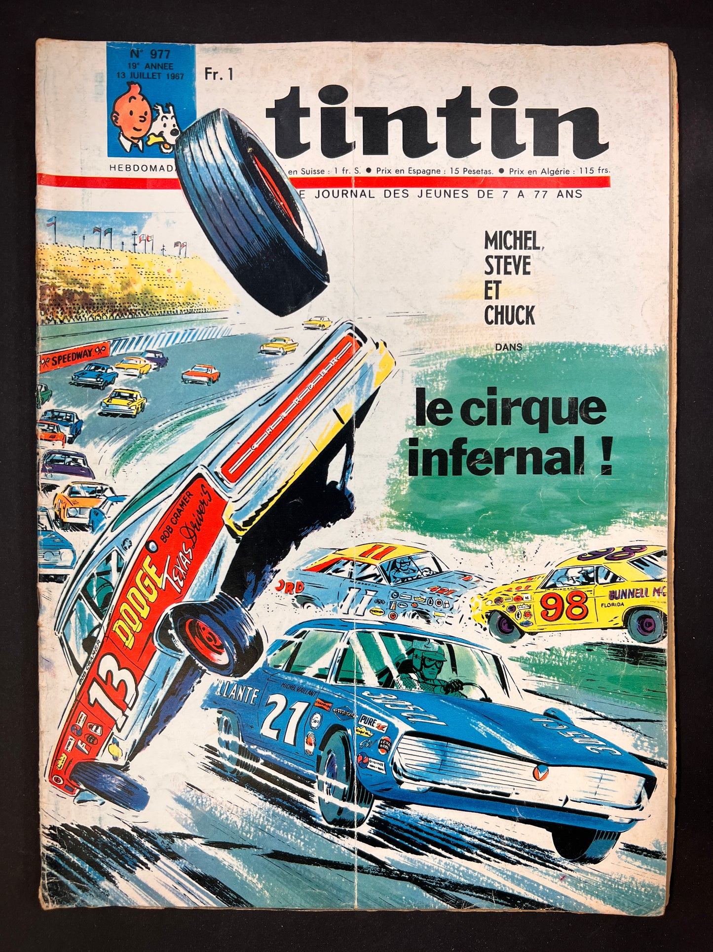Tintin magazine cover featuring dramatic car crash in Michel Vaillant comic race, titled "Le cirque infernal!" July 1967 issue