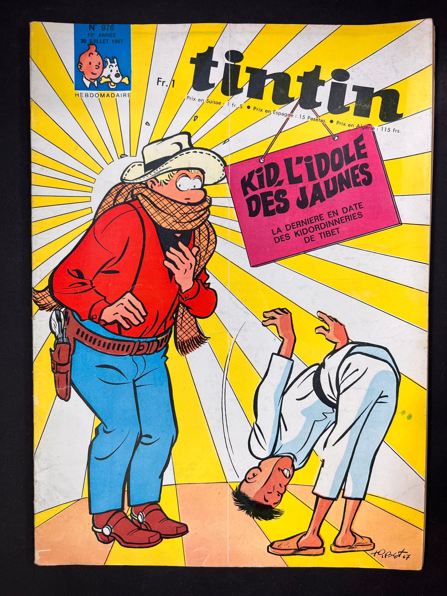 Tintin magazine cover 1967: Cowboy Kid Ordinn surprised by bowing martial arts student, vibrant yellow sunburst background