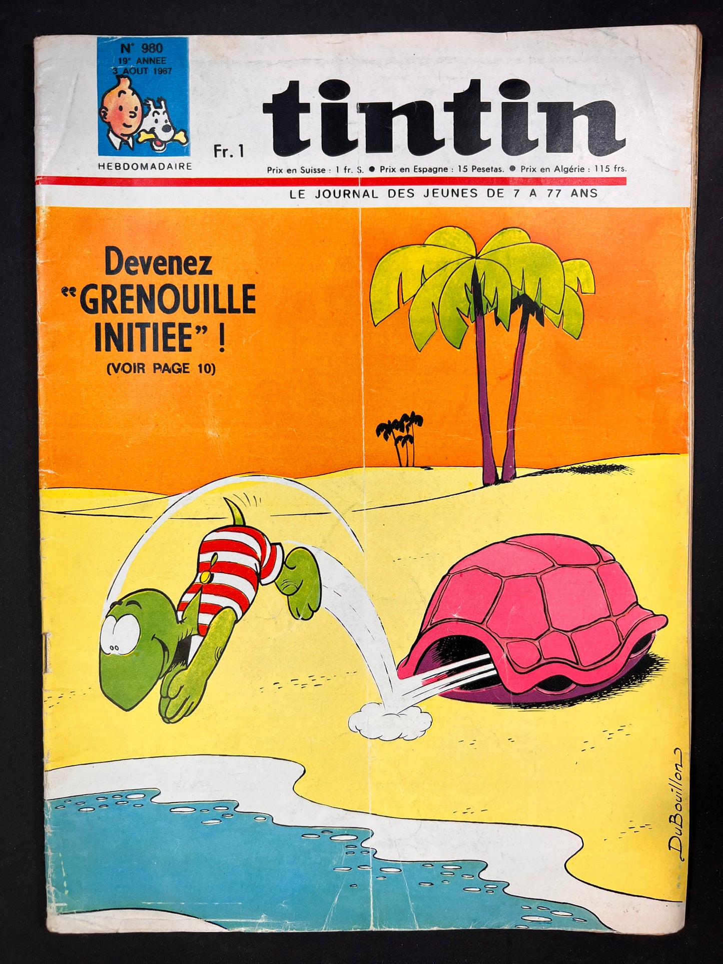 Tintin magazine cover 1967: Cartoon turtle in striped swimwear diving into desert oasis, palm trees, vintage comic art