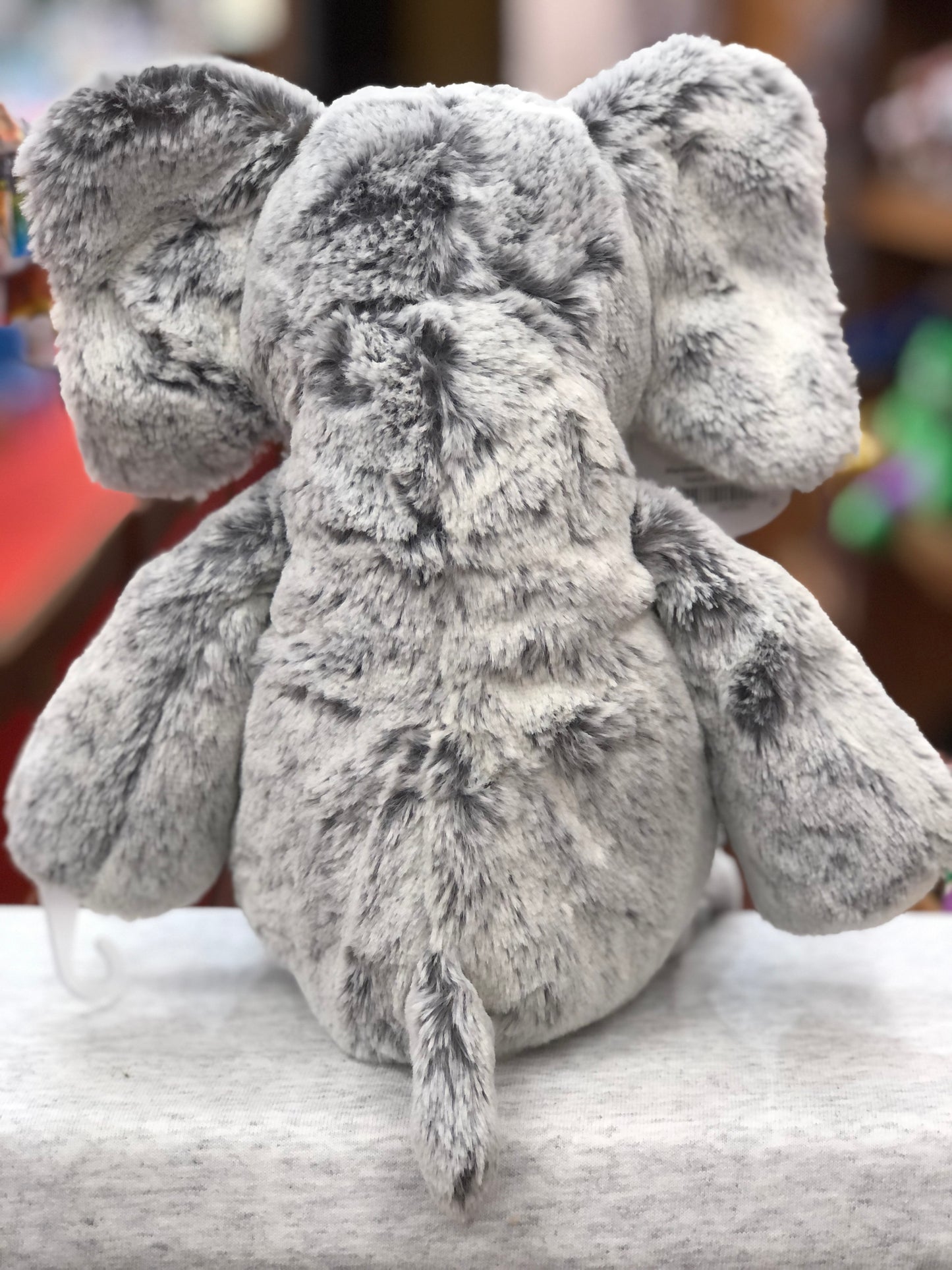 Soft gray Mary Meyer Marshmallow Elephant plush toy, 13 inches tall, with floppy ears and tail, perfect for snuggling