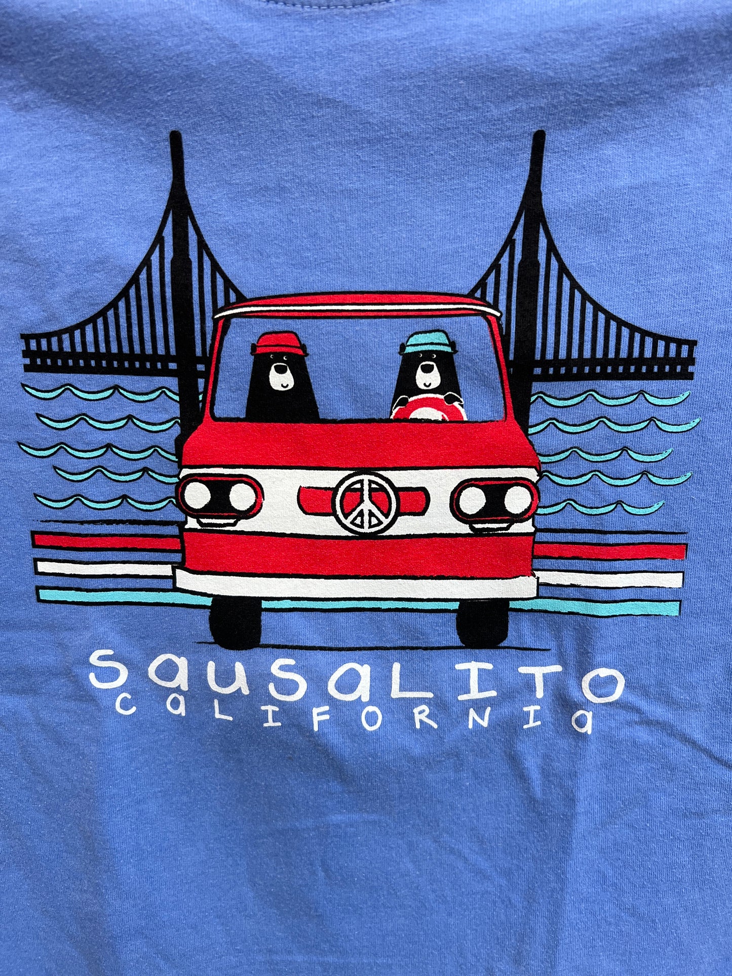 Sausalito kids' t-shirt with cartoon bears driving red van near Golden Gate Bridge, blue background