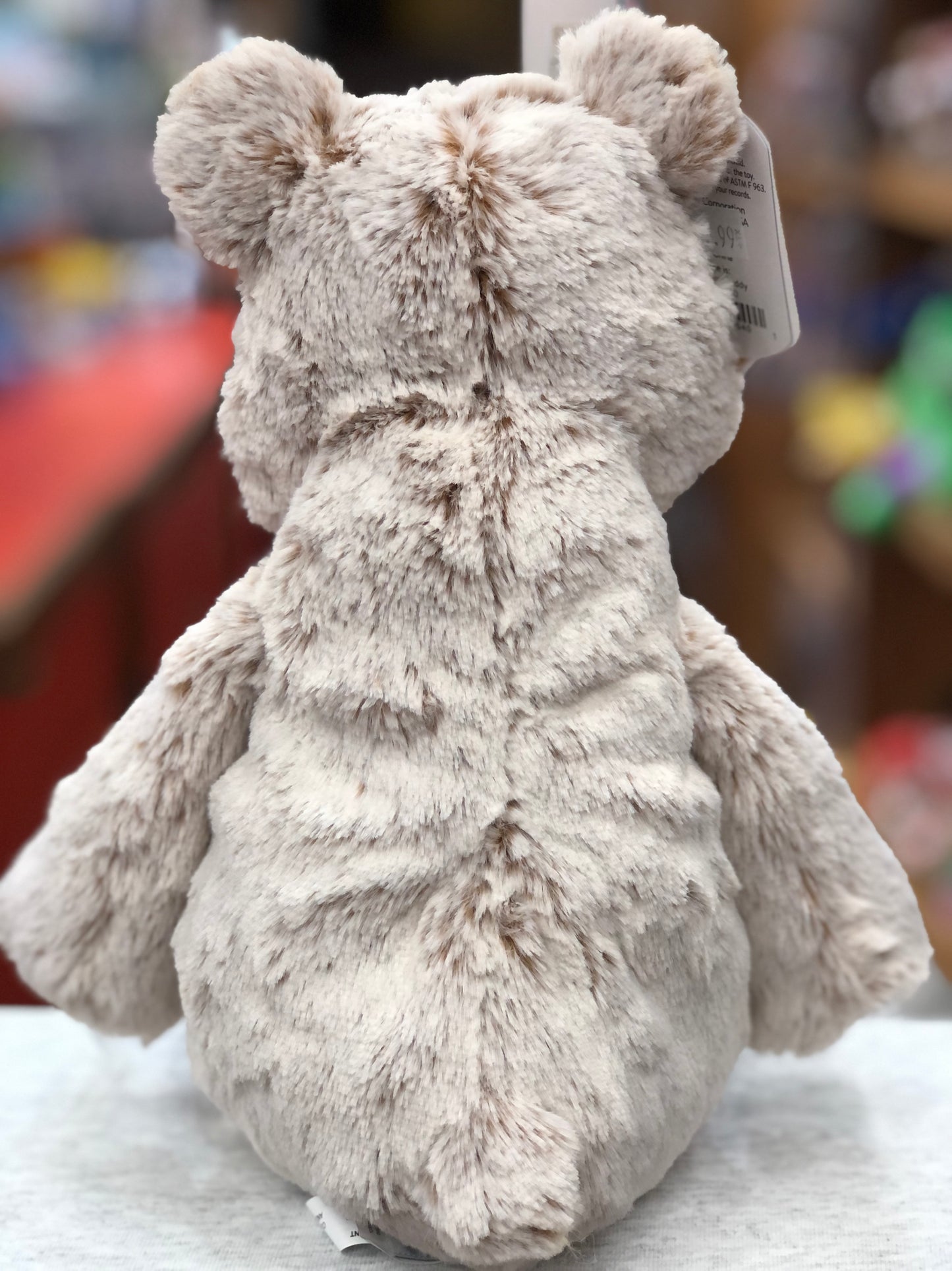 Soft, fluffy 13-inch Marshmallow Teddy Bear plush toy with beige fur, shown from behind, perfect for cuddling and comfort