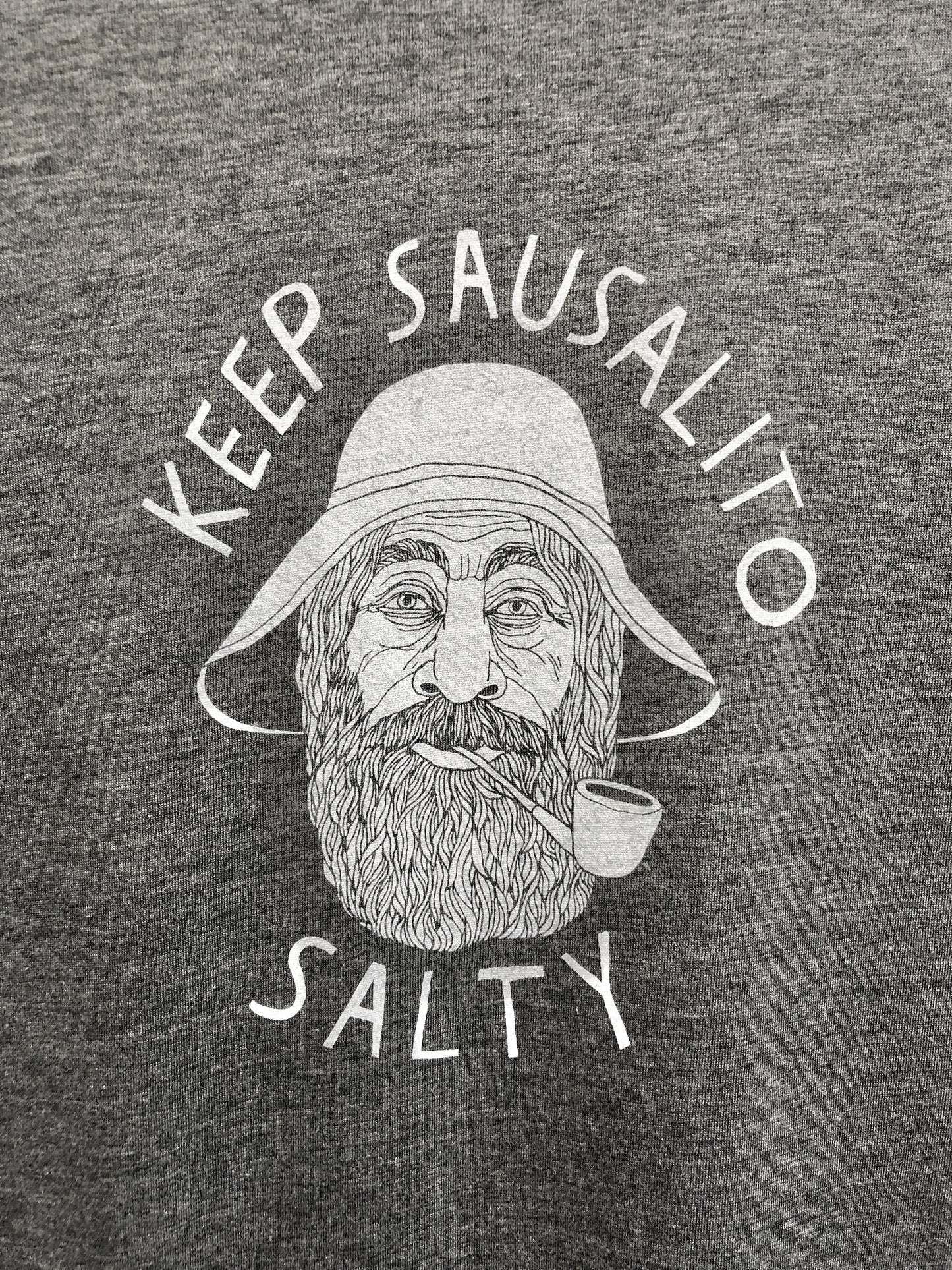 Grey t-shirt with "Keep Sausalito Salty" slogan and illustration of bearded sailor smoking pipe