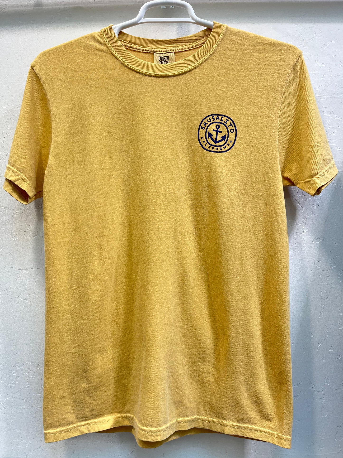 Yellow Comfort Colors t-shirt with Sausalito California anchor logo, showcasing "Keep Calm and Sail On" unisex design