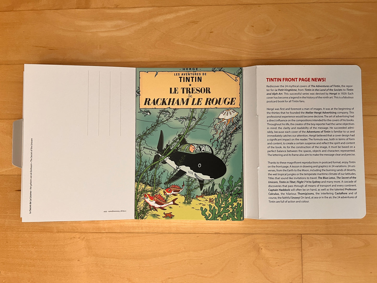 Tintin book cover postcard collection featuring "Le Tresor de Rackham le Rouge" with submarine underwater scene and descriptive text