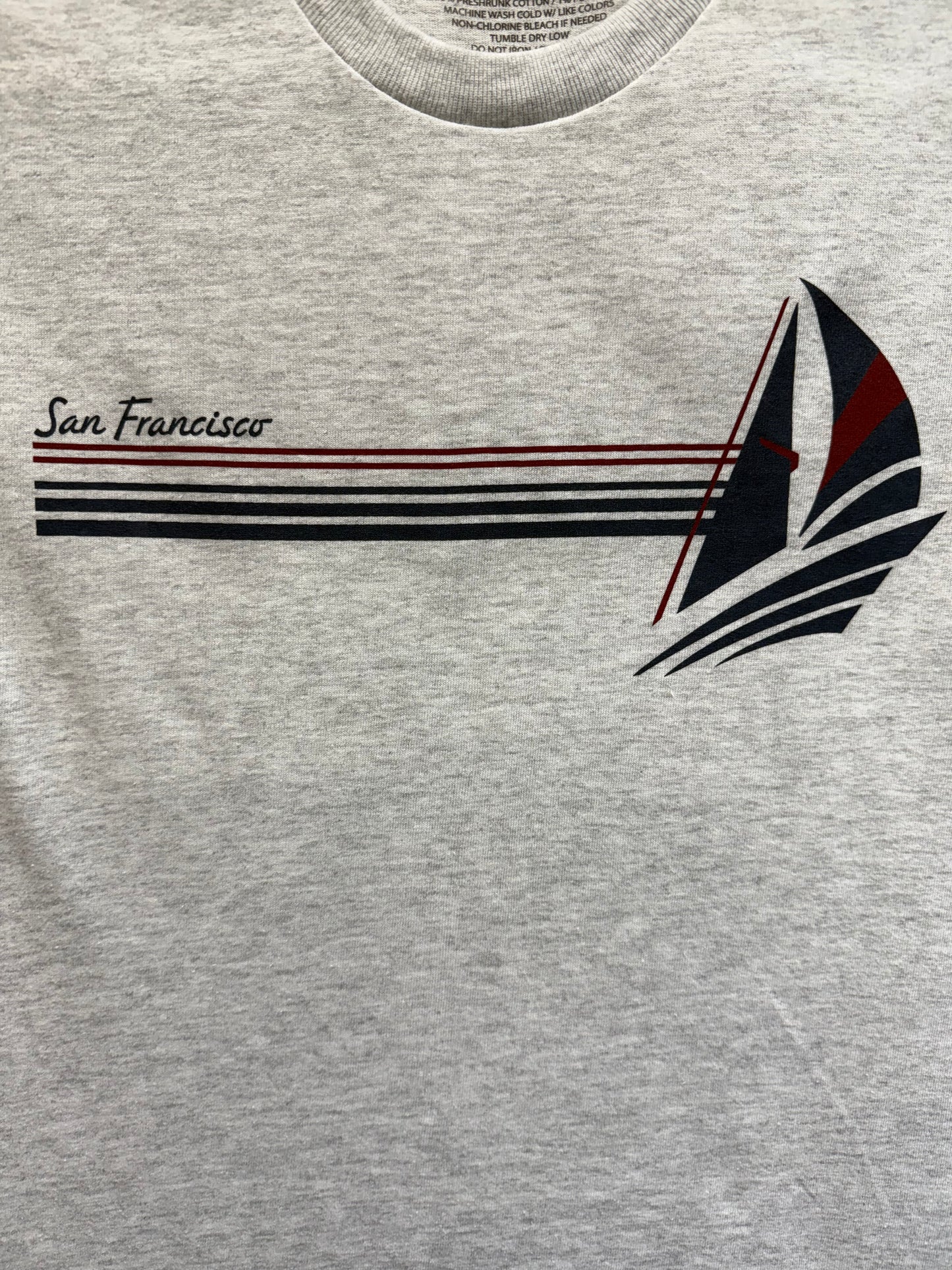 Retro San Francisco t-shirt with stylized sailboat design and city name, gray cotton blend fabric