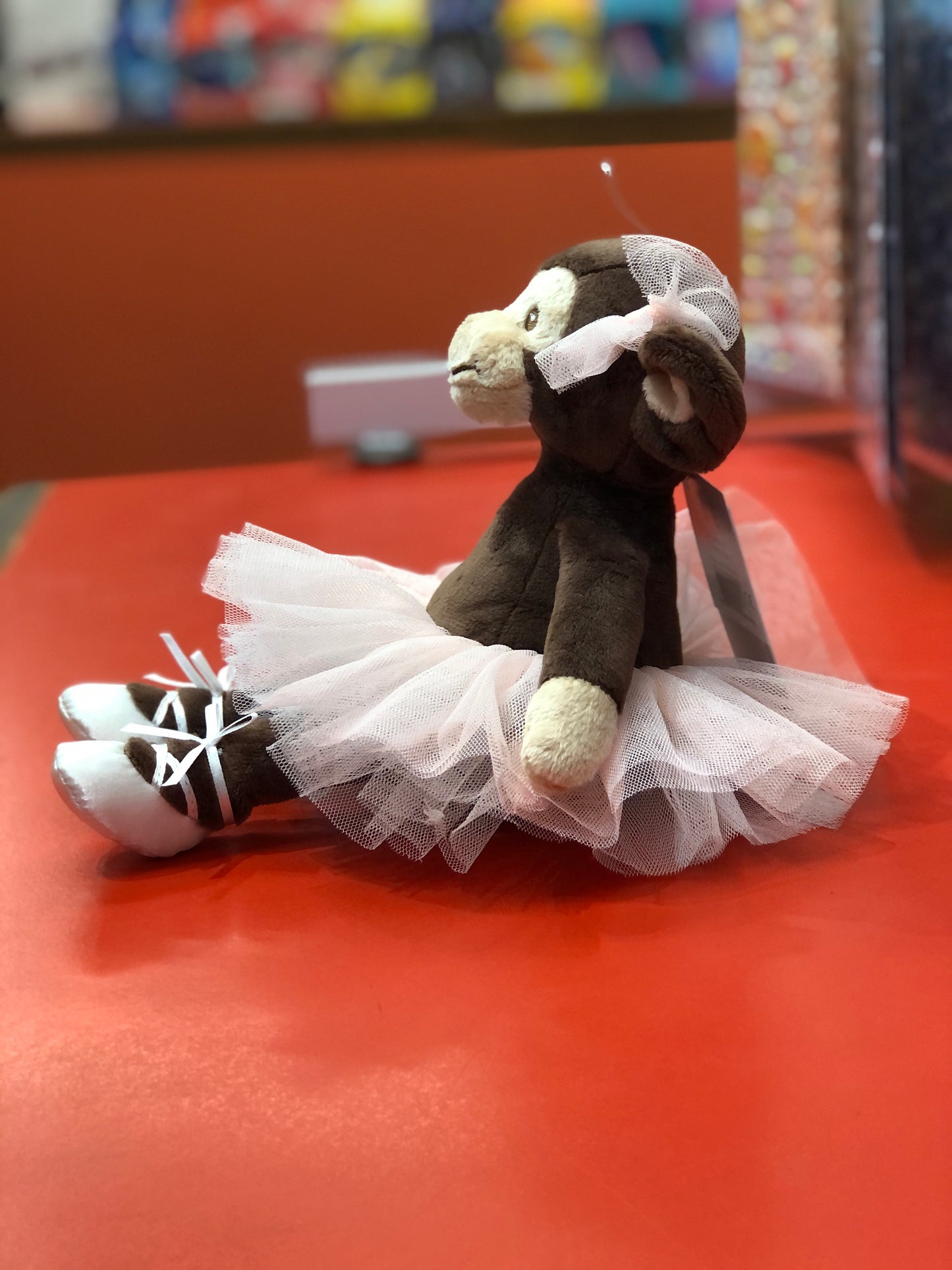 Bukowski Bears Sweet Missy Monkey ballerina plush toy in tutu and ballet shoes on red surface