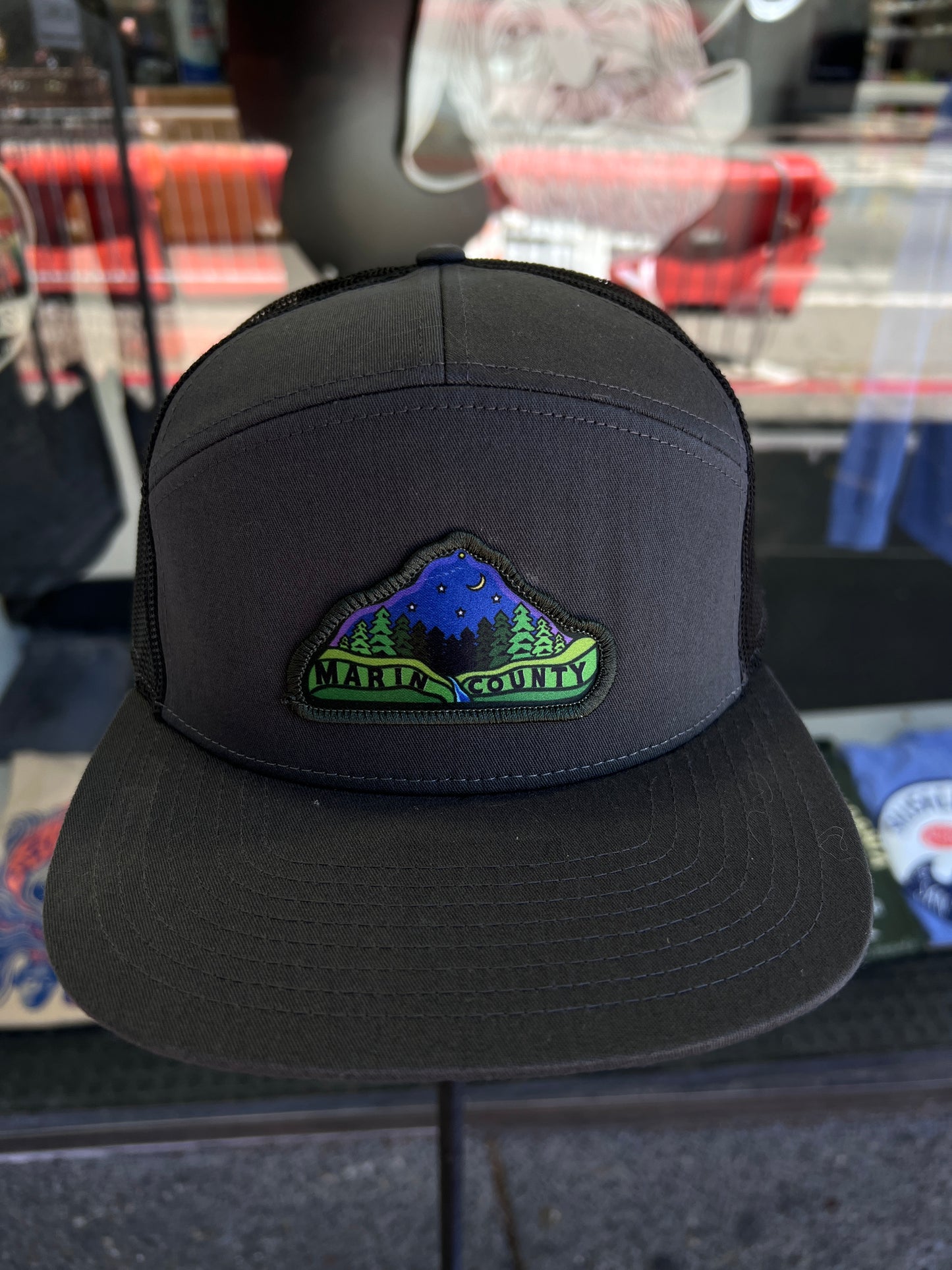 Marin County trucker cap with night sky and redwoods patch, black mesh back, adjustable fit