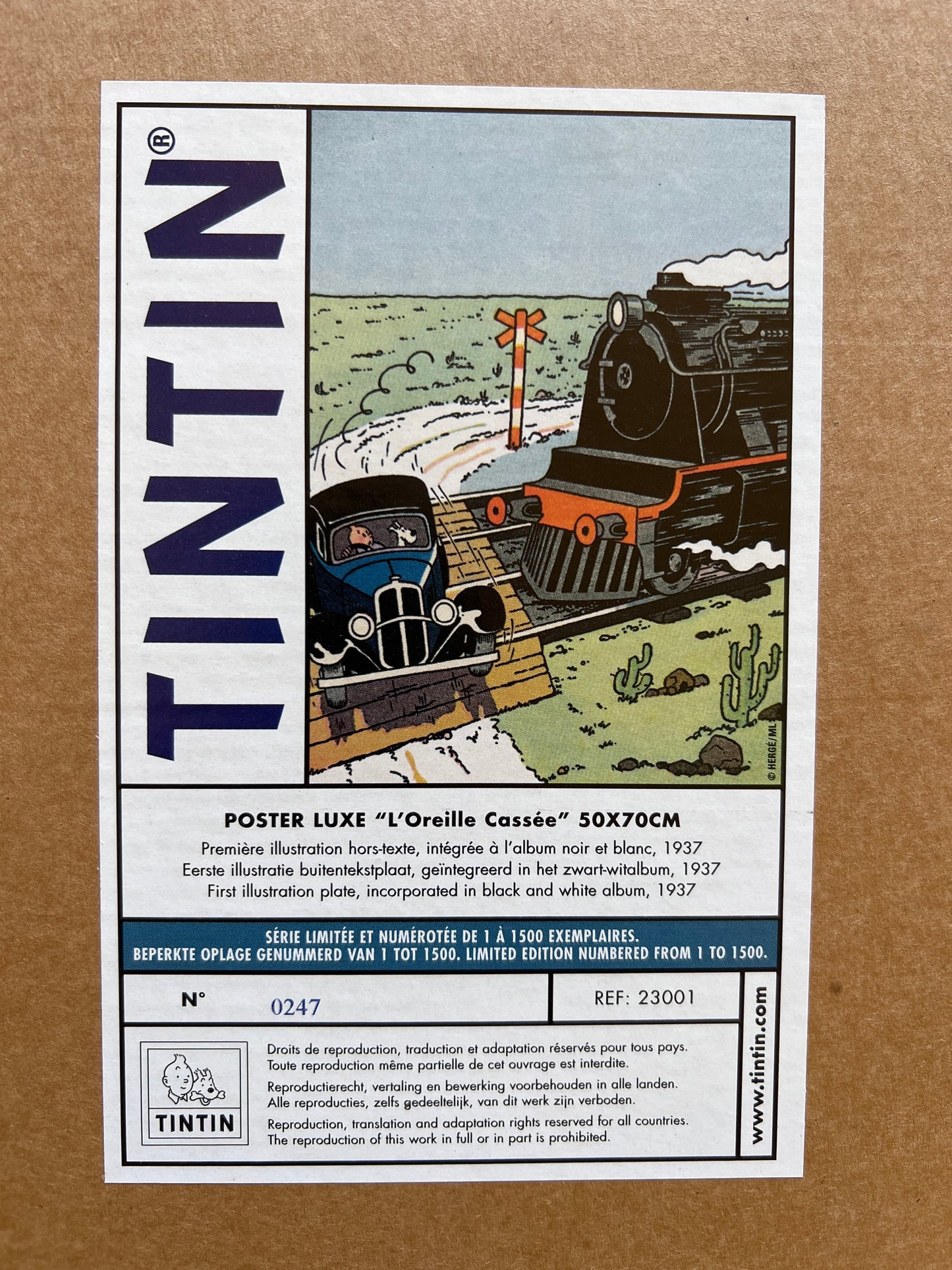 Tintin poster L'Oreille Cassée, limited edition serigraph featuring car and train in desert landscape, 50x70cm, numbered 0247/1500