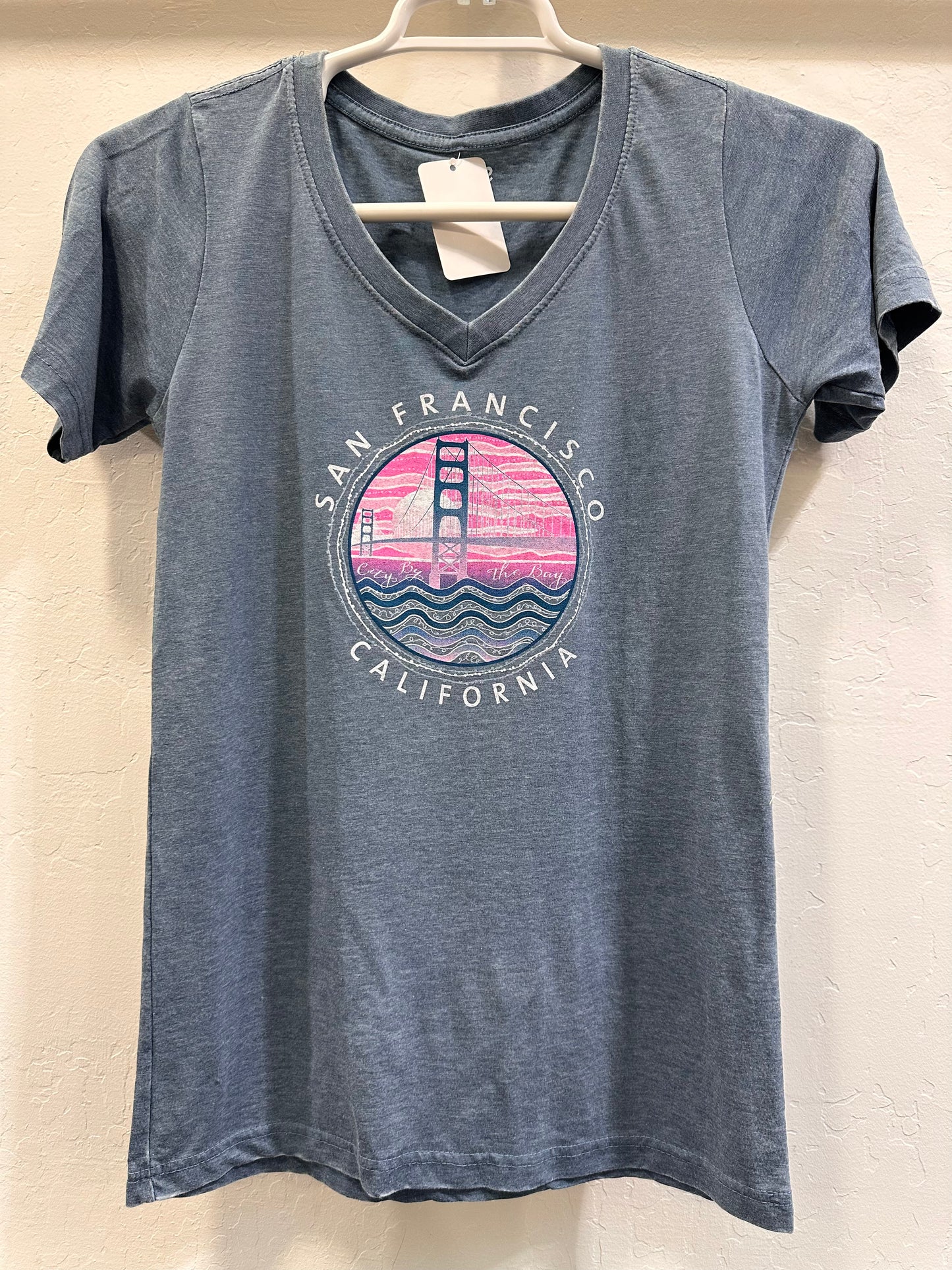 San Francisco Golden Gate Bridge women's v-neck t-shirt with colorful distressed circular design featuring pink sunset and waves