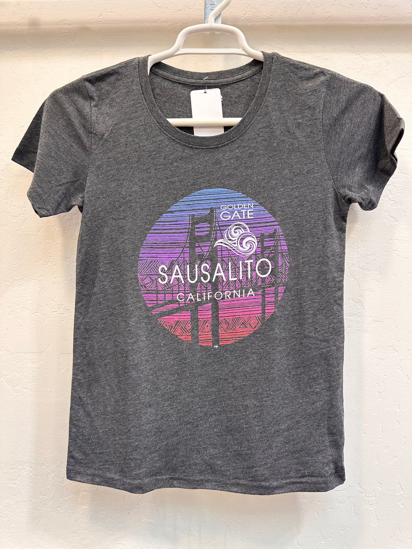 Sausalito women's t-shirt with Golden Gate Bridge sunset design, showcasing colorful graphic on soft gray fabric