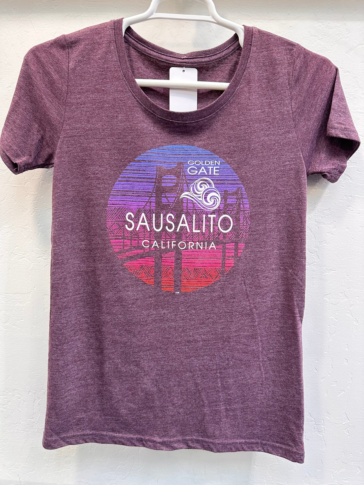 Purple women's t-shirt with Sausalito Golden Gate Bridge sunset design, showcasing soft fabric blend for comfortable wear