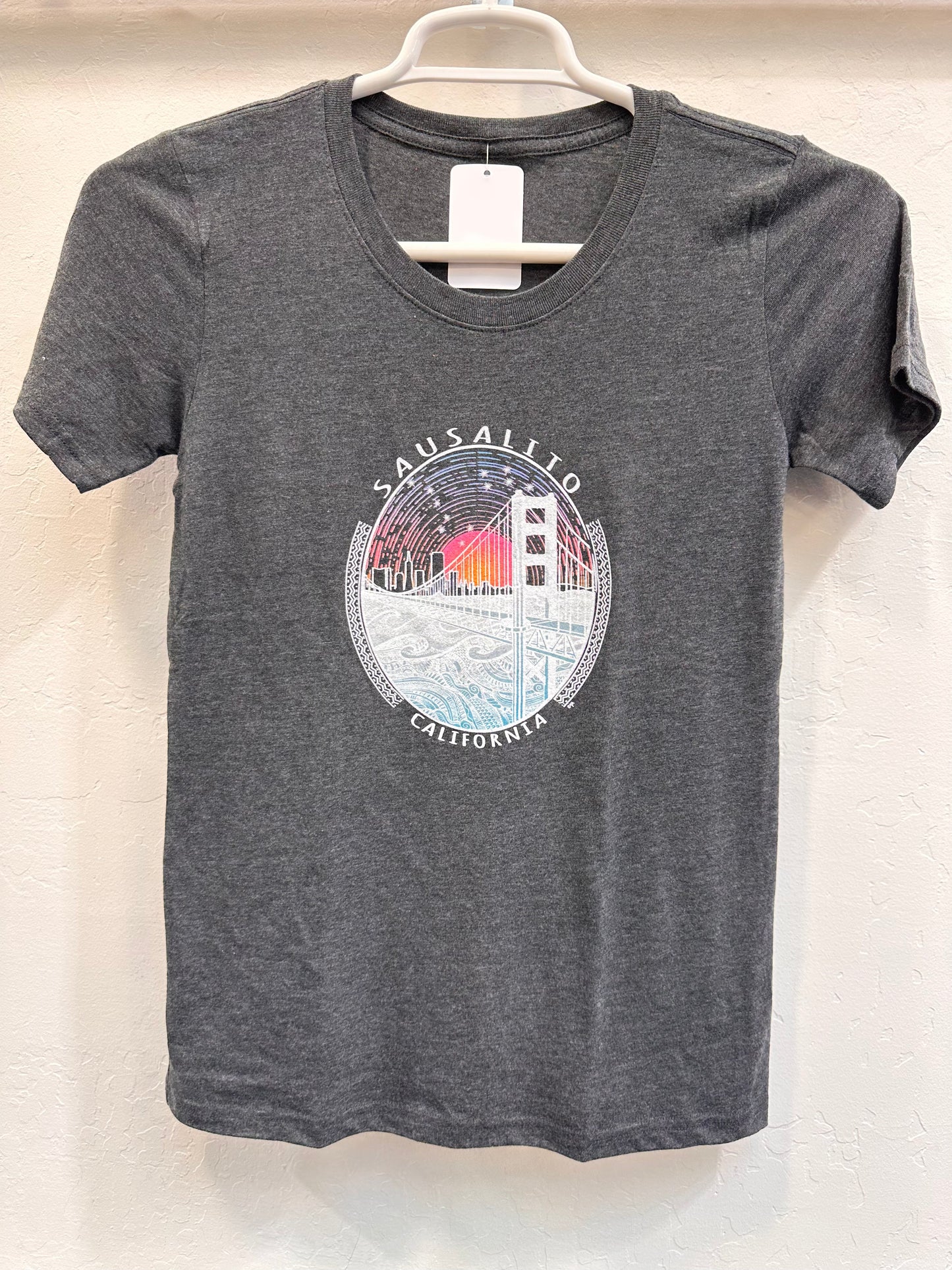 Against the sunrise in the east, the Golden Gate Bridge and the swirling waters of San Francisco bay below is a different take on this classic image. Women's crewneck t shirt is constructed of 50% polyester, 37% cotton and 13% rayon. The shirt is soft and supple for coolness and comfort.
