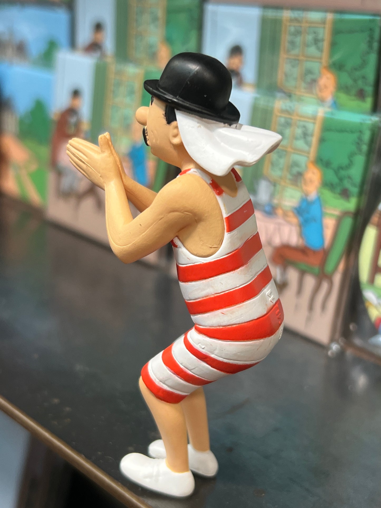 Thomson mini figure in red-striped bathing costume and bowler hat, 9cm tall, with flared mustache, standing in dynamic pose