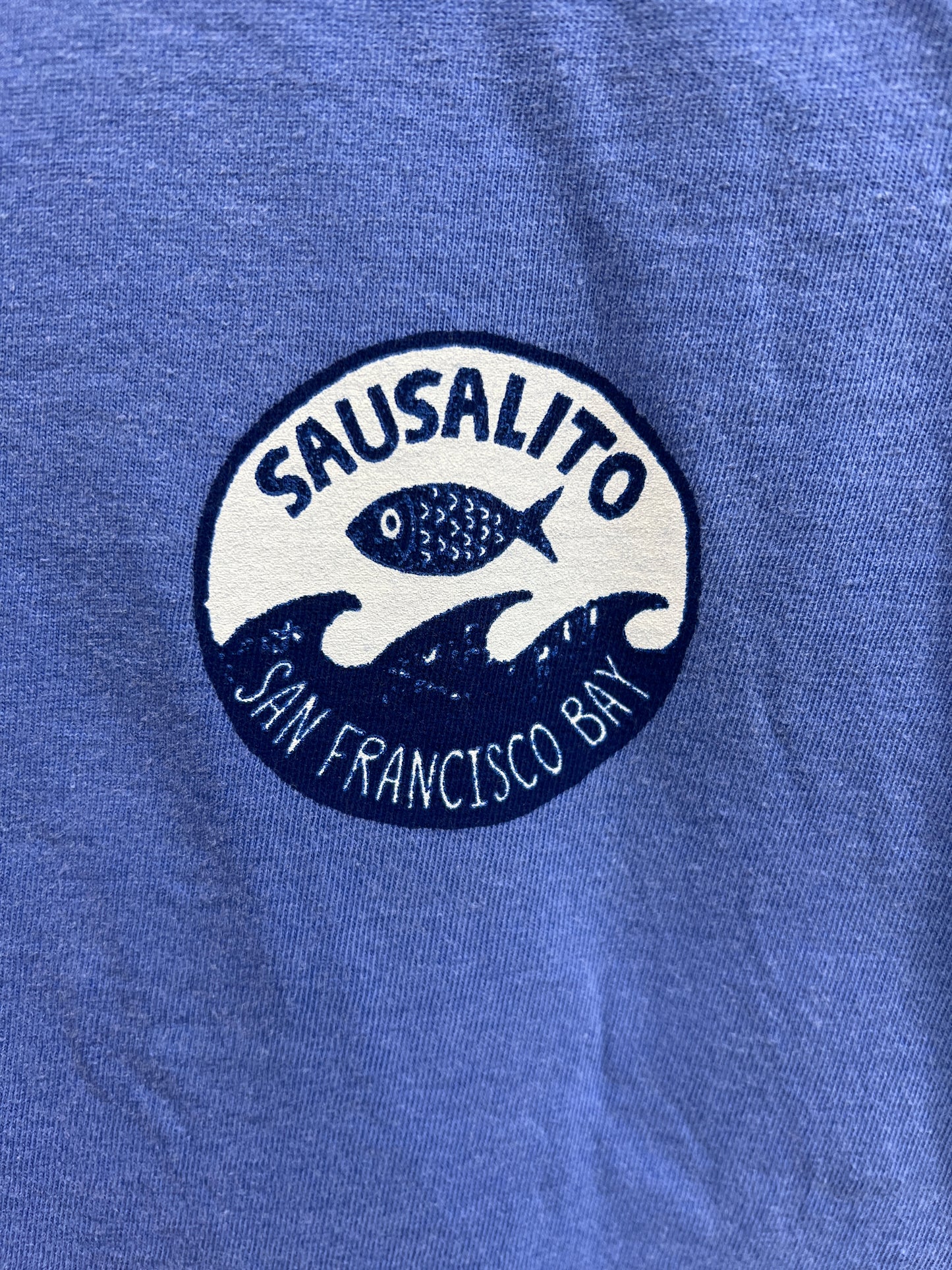 Sausalito Fish Wave logo on light blue kids t-shirt, featuring fish and waves design for San Francisco Bay
