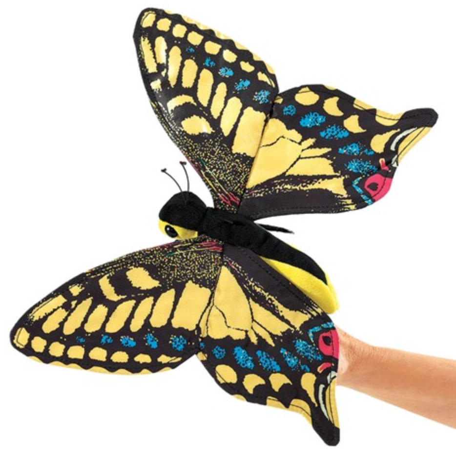 Colorful Folkmanis swallowtail butterfly puppet with yellow and blue wings, held by hand, 12 inches wide