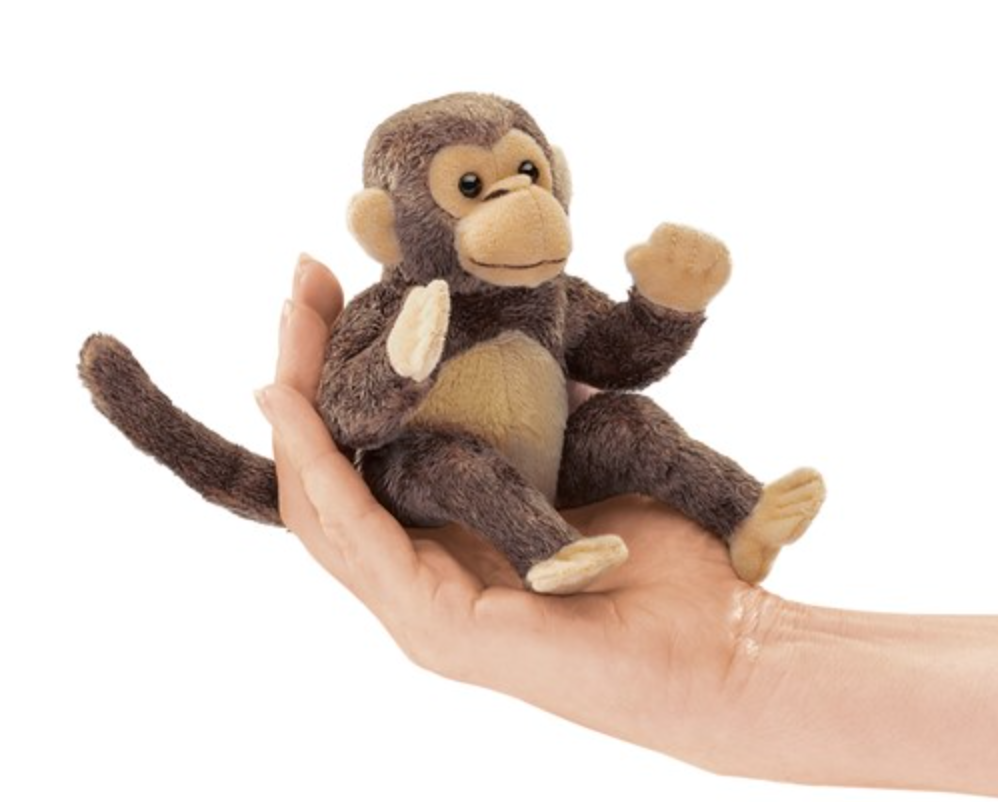 Folkmanis 5-inch Mini Monkey finger puppet, soft brown plush toy sitting in a hand, with long tail and raised arm