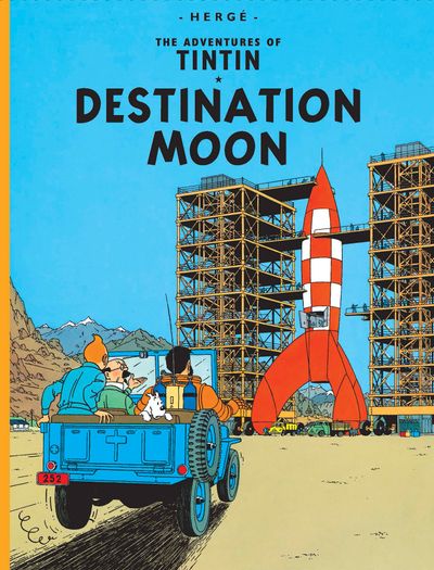 Front cover of "The Adventures of Tintin: Destination Moon" graphic novel by Hergé, featuring Tintin, Captain Haddock, and Snowy riding in the back of a blue truck looking up at a large red-and-white checkered moon rocket resting in a launch pad scaffold frame.