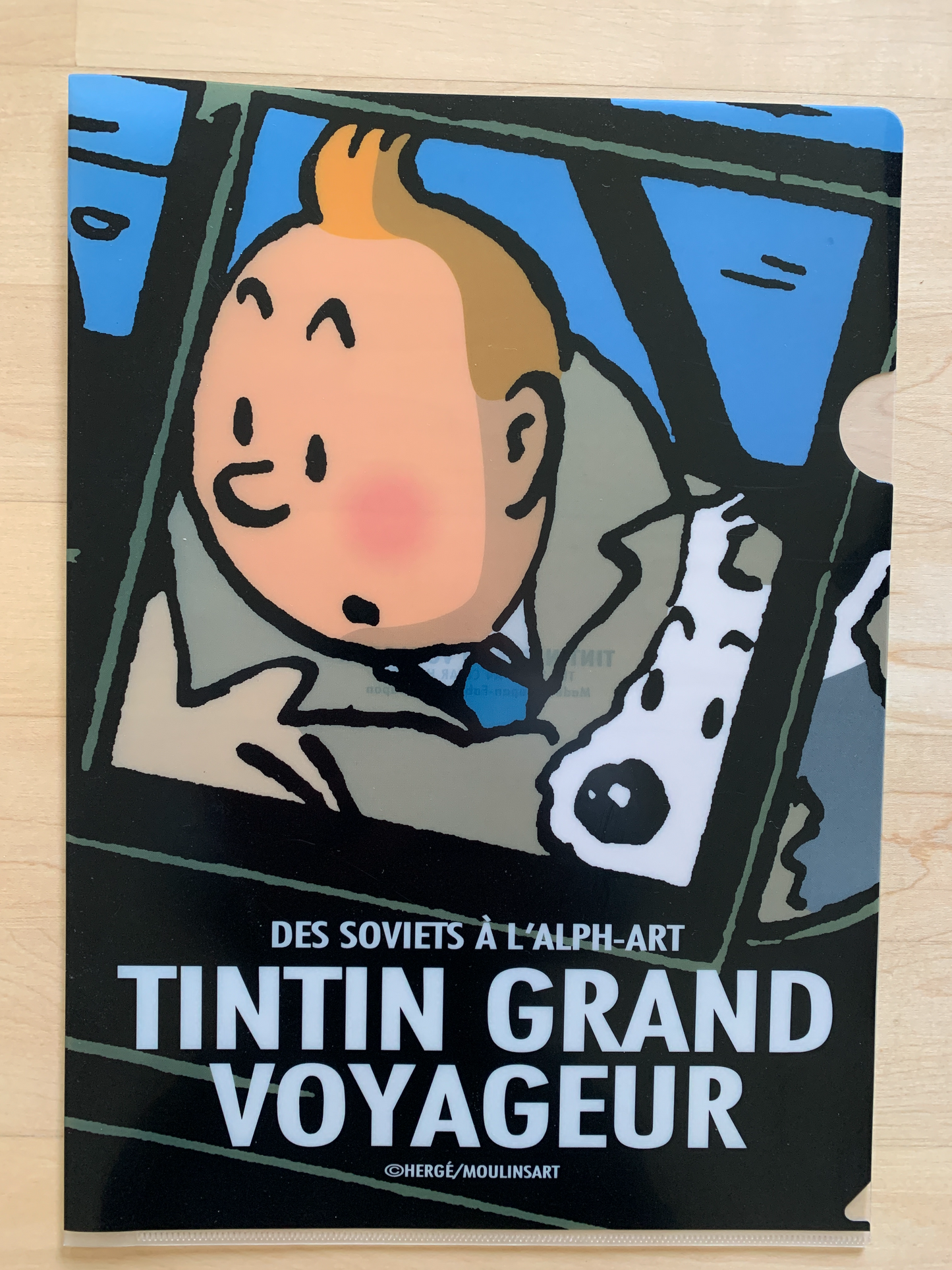Tintin and Snowy A4 folder cover featuring cartoon characters in a vehicle, titled "Tintin Grand Voyageur" in French
