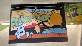 Tintin pop-up card: Characters driving car in colorful cartoon style, viewed from behind