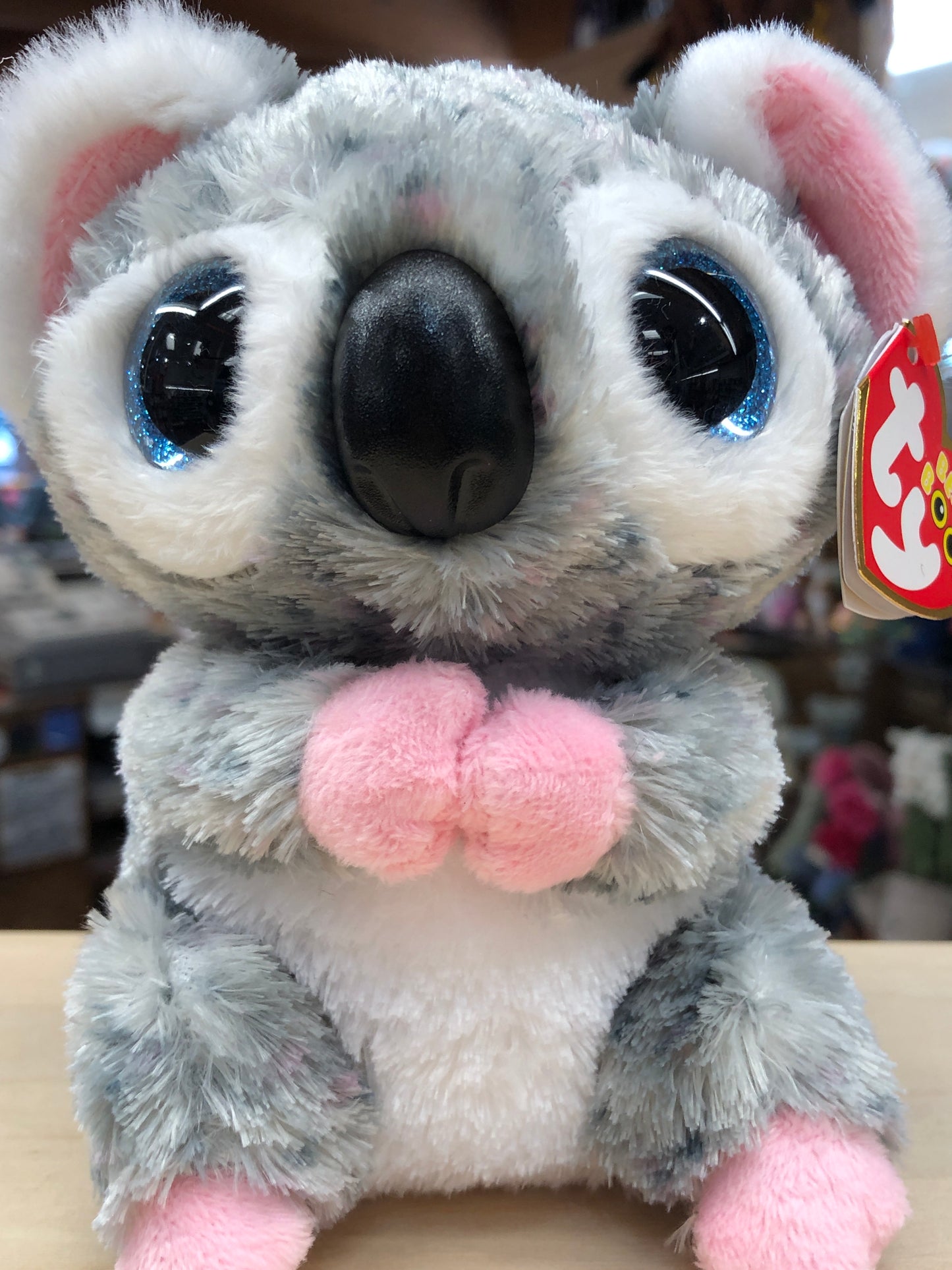 Cute Ty Beanie Boo Karli gray koala plush toy with large blue eyes, pink ears and paws, and fluffy fur, ideal for ages 3+