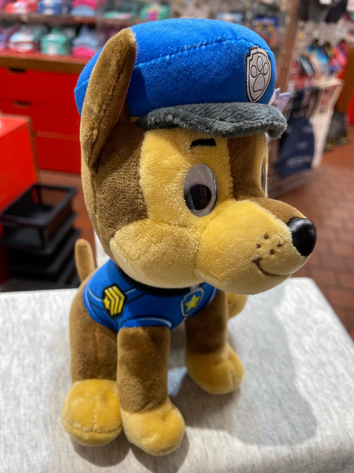 Gund Paw Patrol Chase plush toy in police uniform, featuring embroidered smile and shiny eyes, perfect for young fans