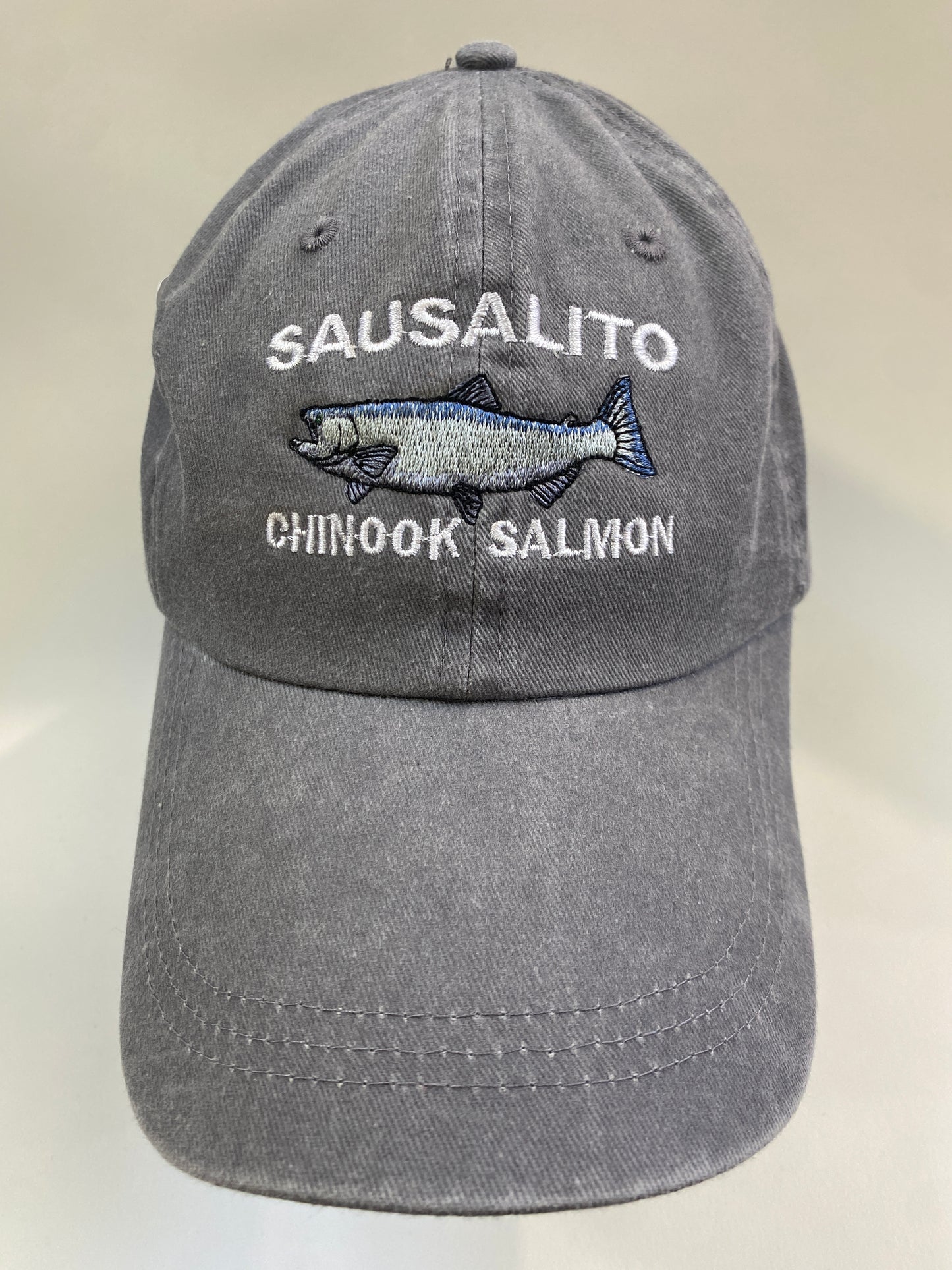 Gray cotton cap with embroidered Sausalito Chinook Salmon design, featuring white text and detailed fish image