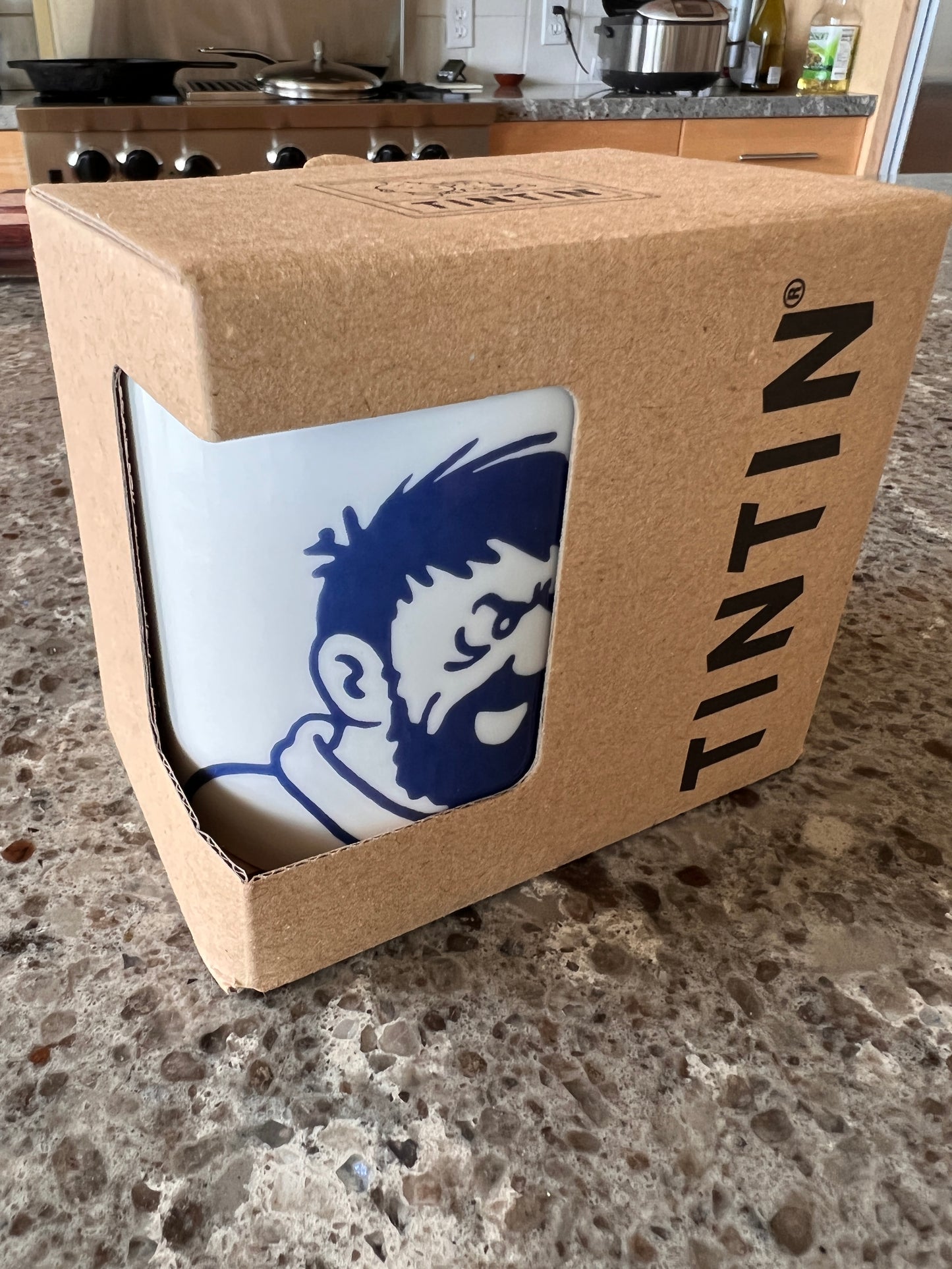 Captain Haddock mug in gift box, showing blue character design on white porcelain, Tintin branding visible