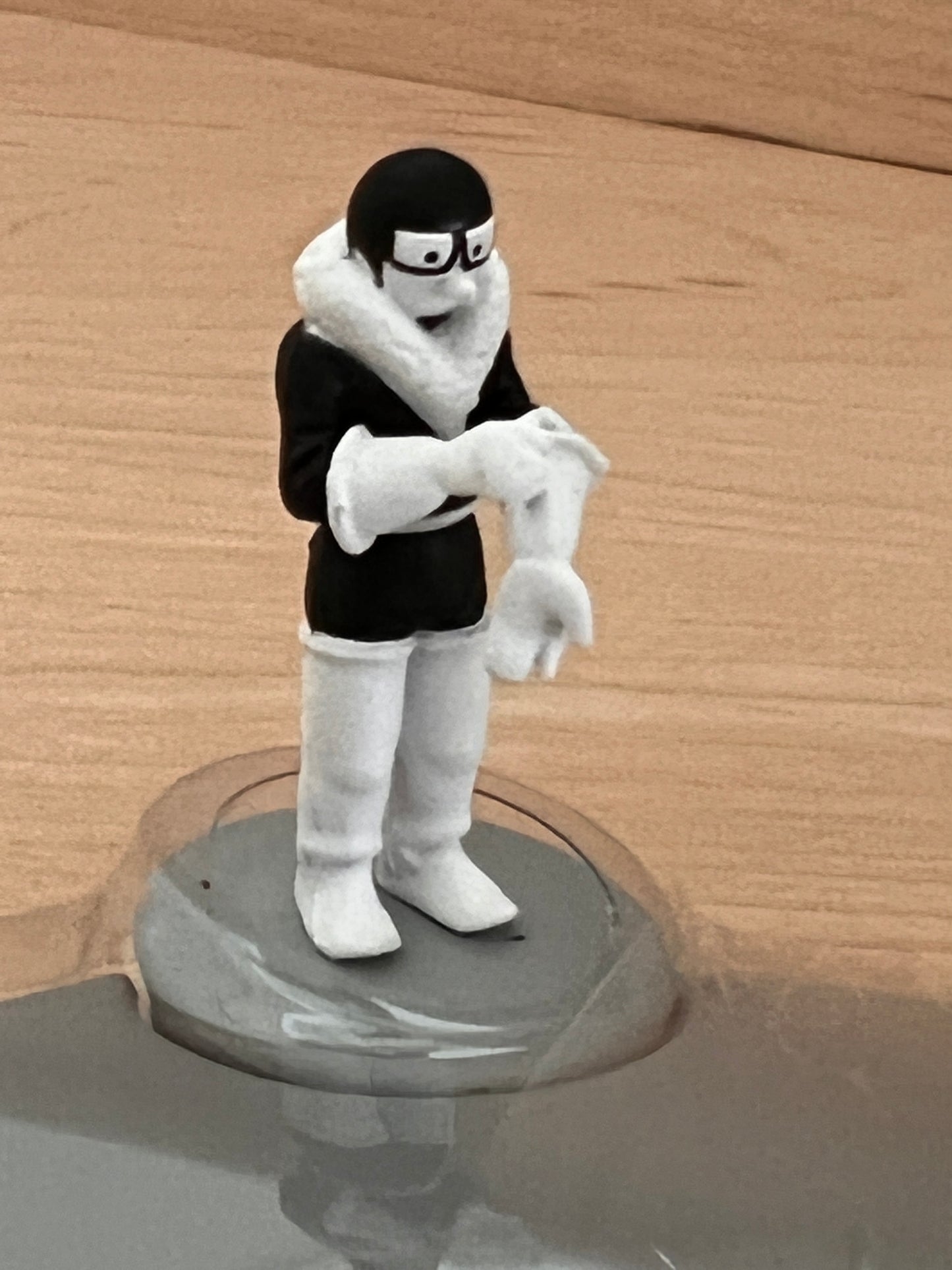Tintin figurine from 'Land of the Soviets' in winter clothing, standing on display base, 1:72 scale model