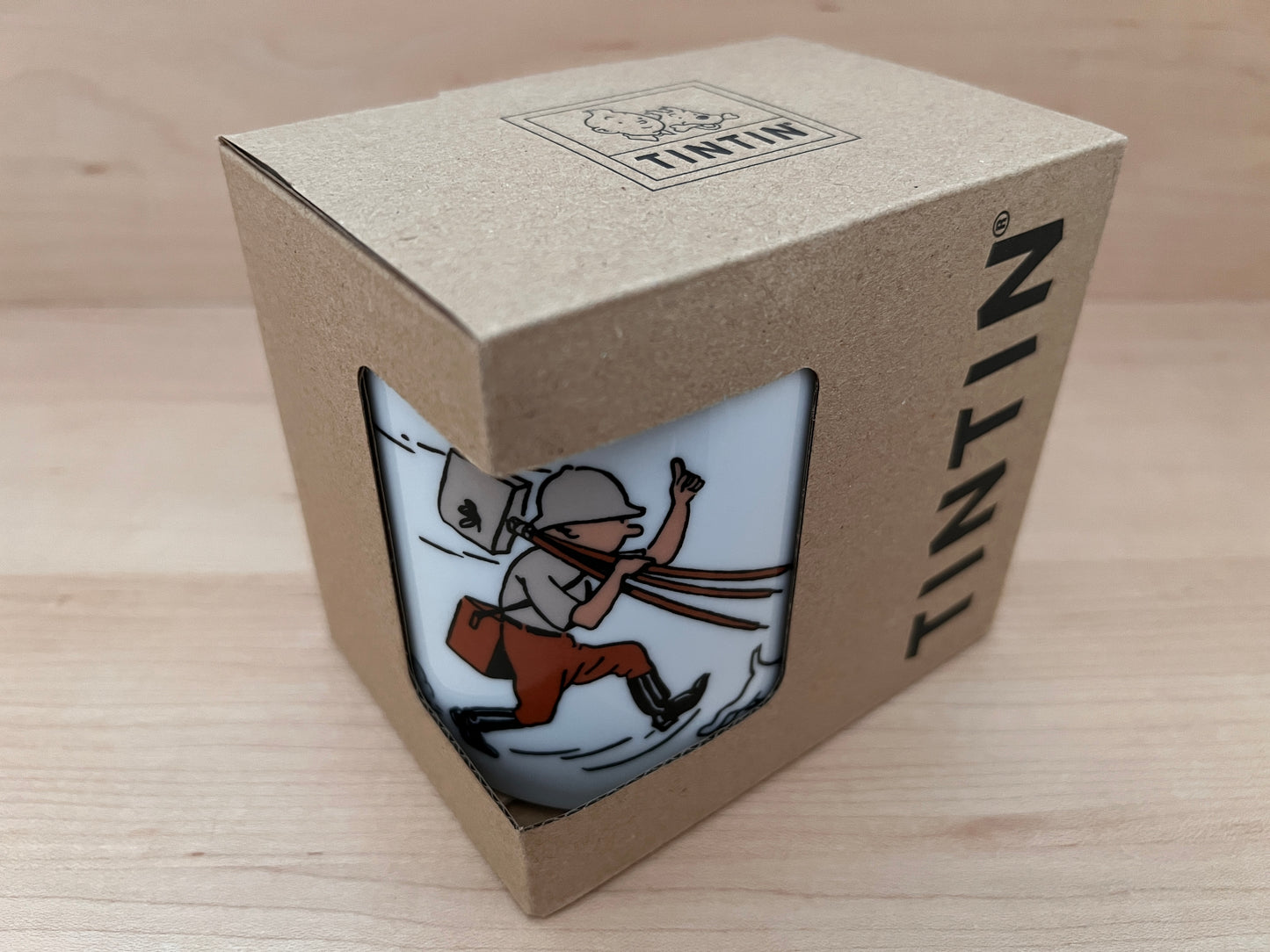 Tintin mug gift box showing cartoon character running with camera, dog at feet. Packaging displays Tintin logo and image preview.