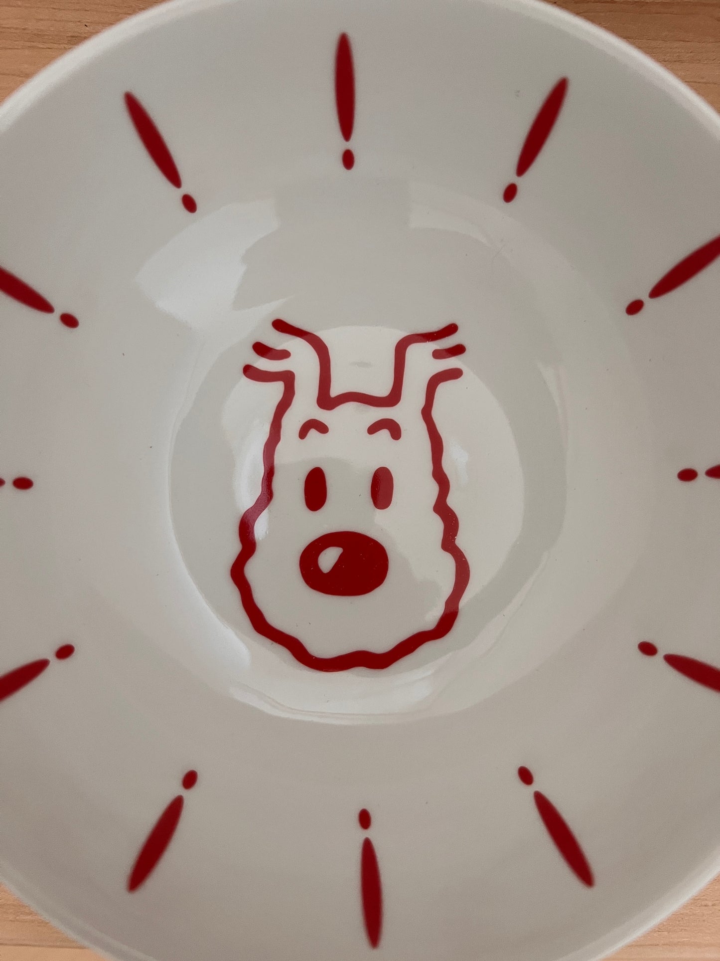 Surprised snowy porcelain bowl with red cartoon face design, versatile for cereal, soup, and ice cream, microwave-safe
