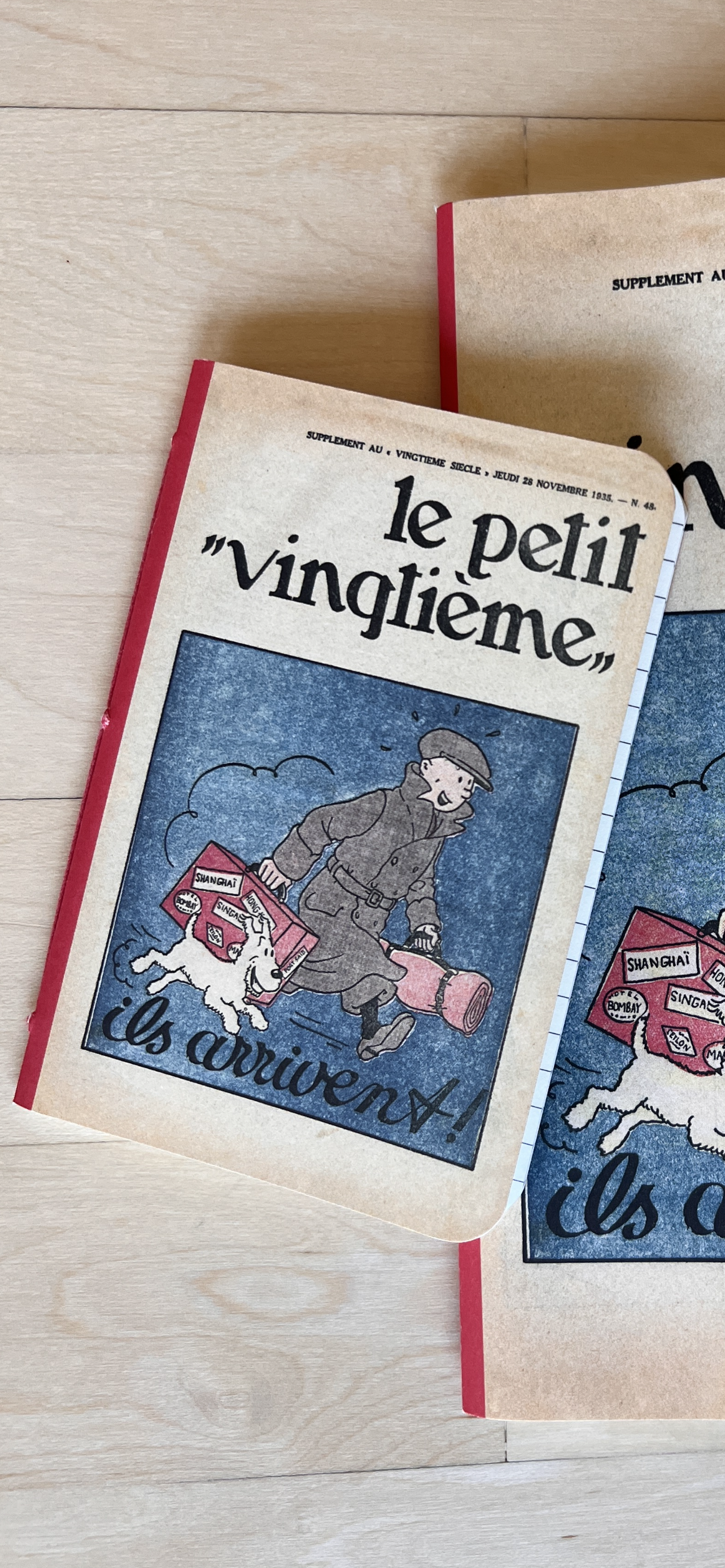 Tintin Le Petit Vingtieme notebooks featuring 1935 cover with cartoon character and dog arriving, in two sizes