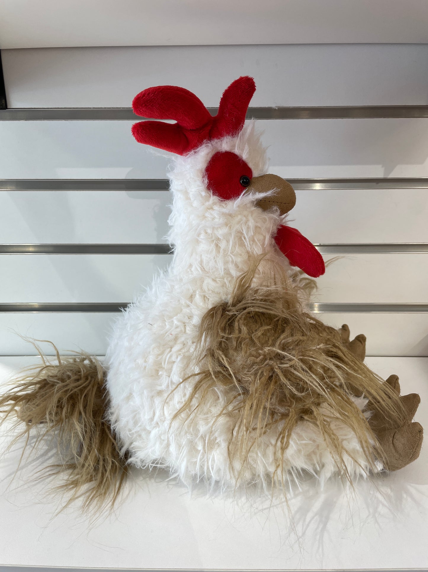 Fluffy white and tan FabFuzz rooster plush toy with bright red comb and wattles, sitting on display shelf