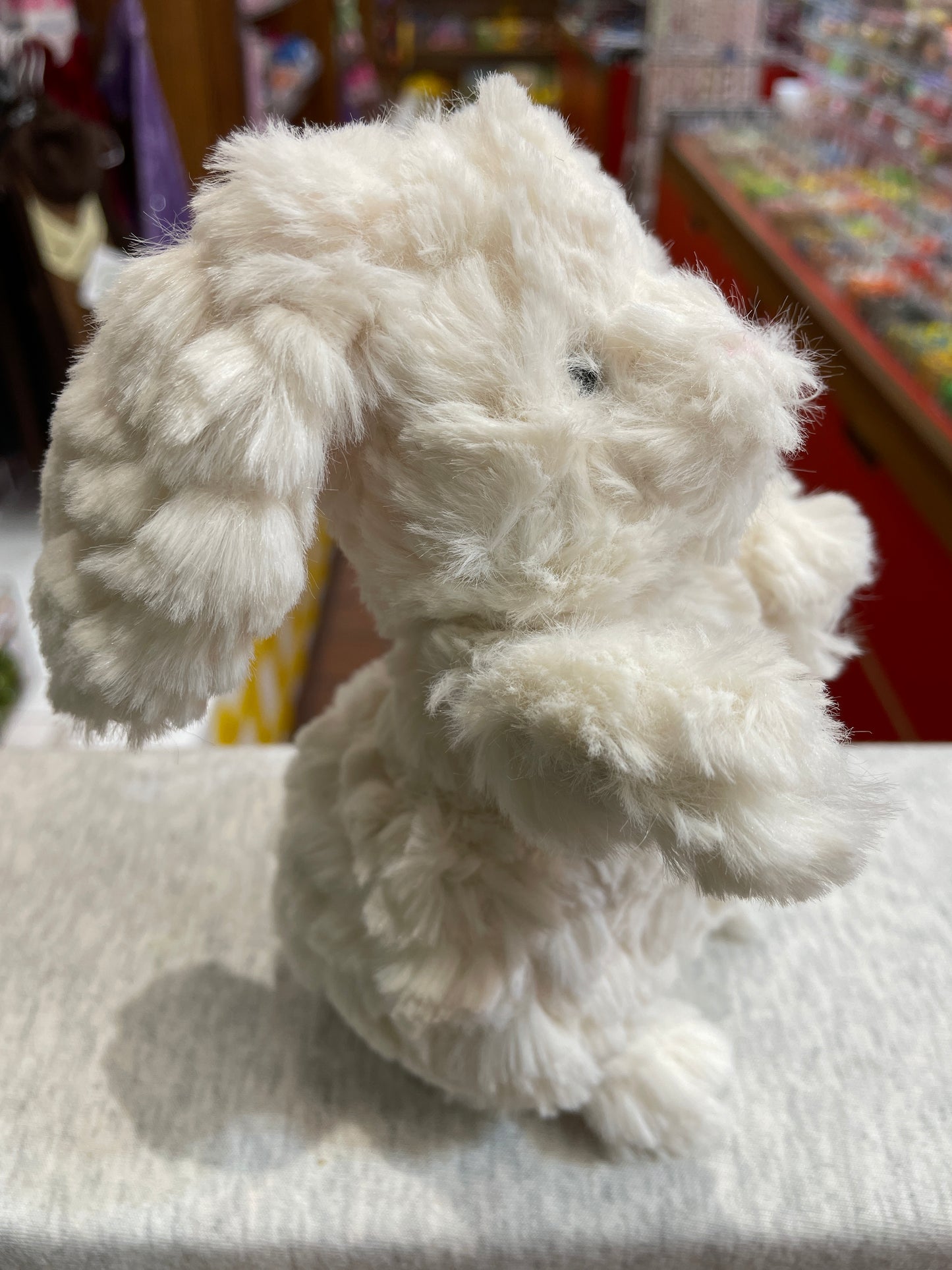 Soft white Puttling Bunny plush toy in store, 6-inch size, fluffy texture, ideal for children's companionship