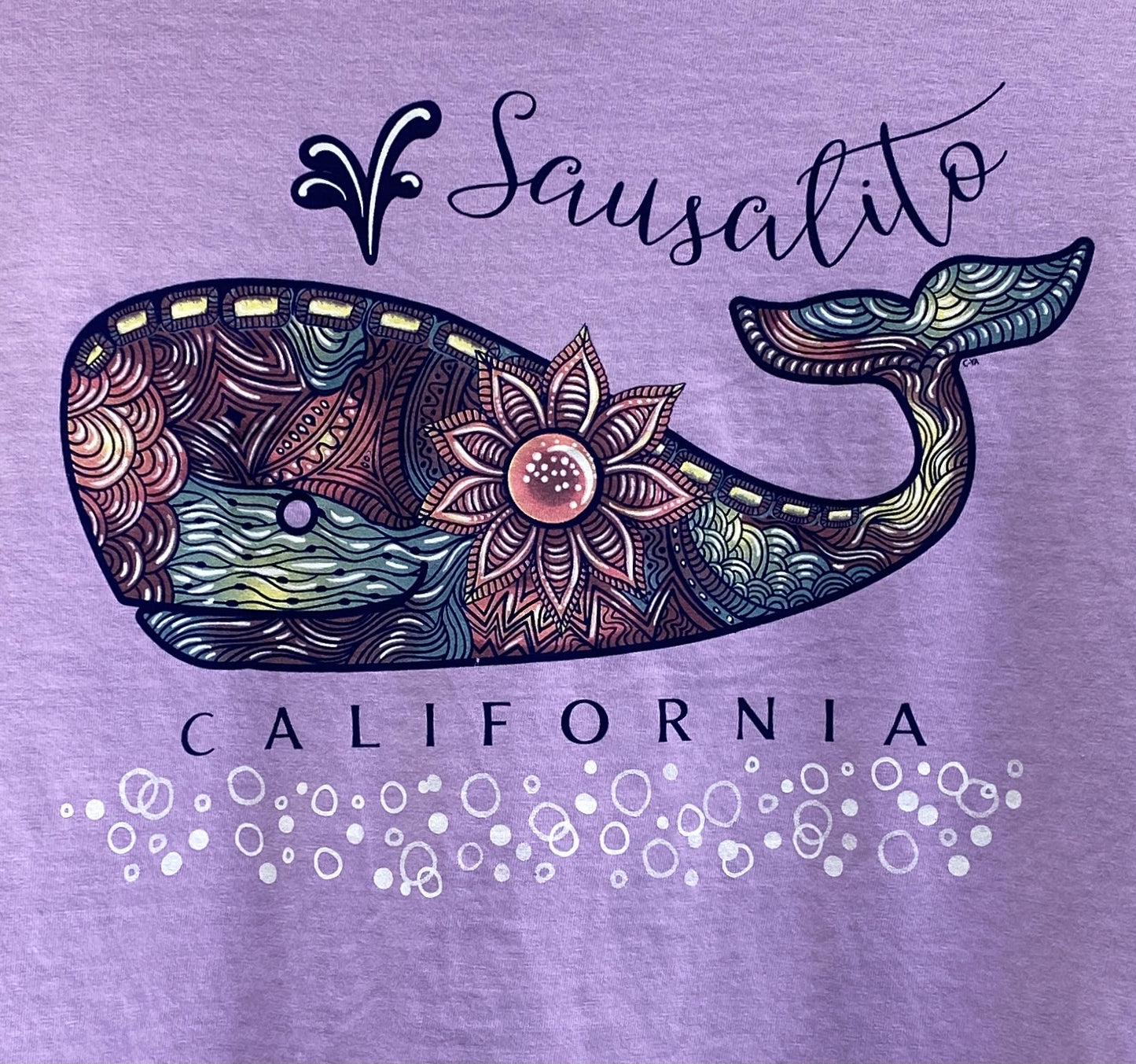 Colorful mandala whale design on purple Sausalito California long sleeve t-shirt with floral and water motifs