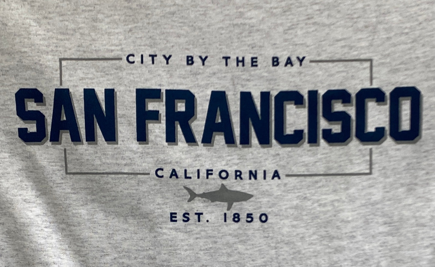 San Francisco t-shirt design with "City by the Bay" text, shark logo, and "EST. 1850" on gray cotton fabric