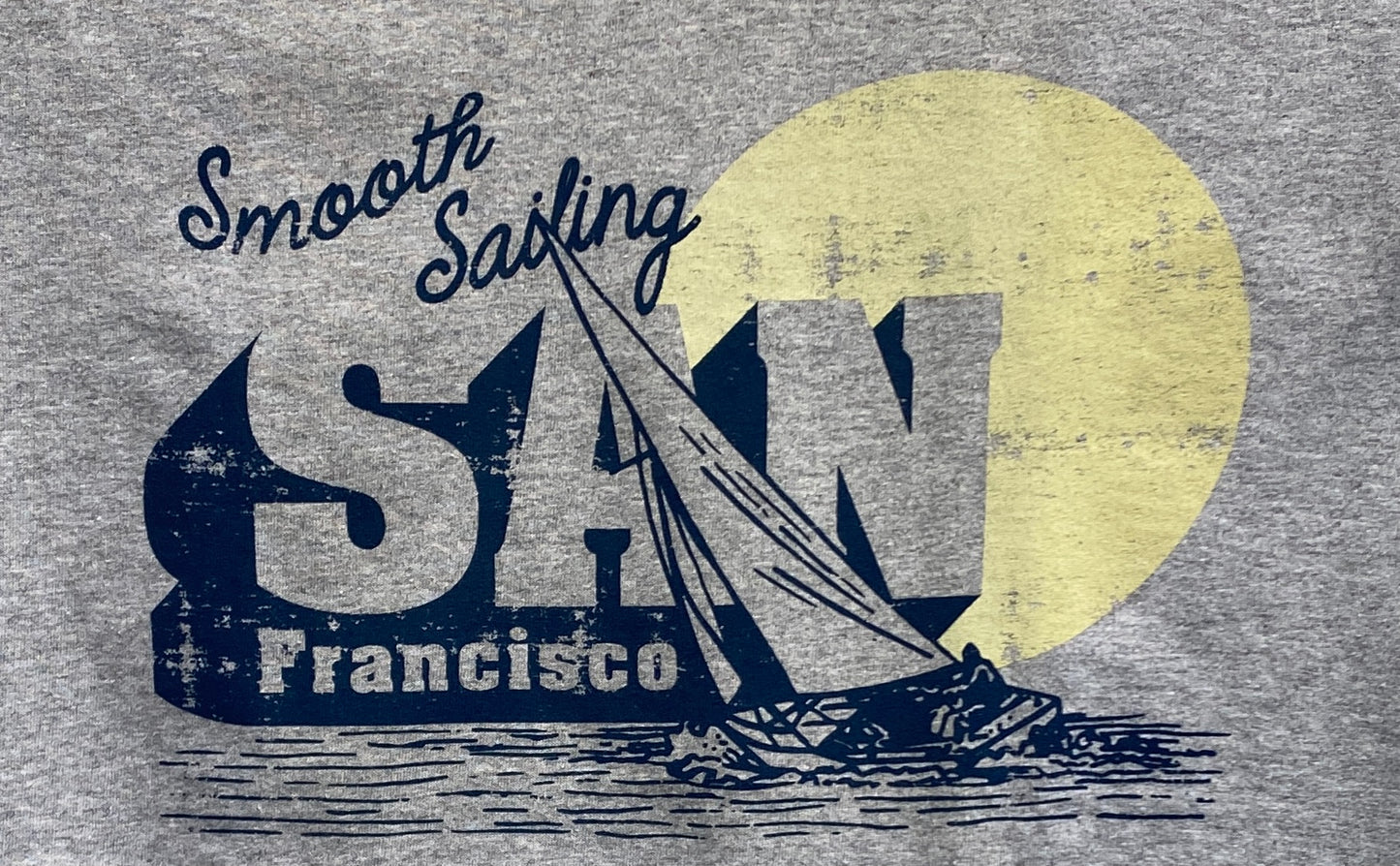 San Francisco Smooth Sailing t-shirt design with sailboat silhouette and city skyline against yellow moon