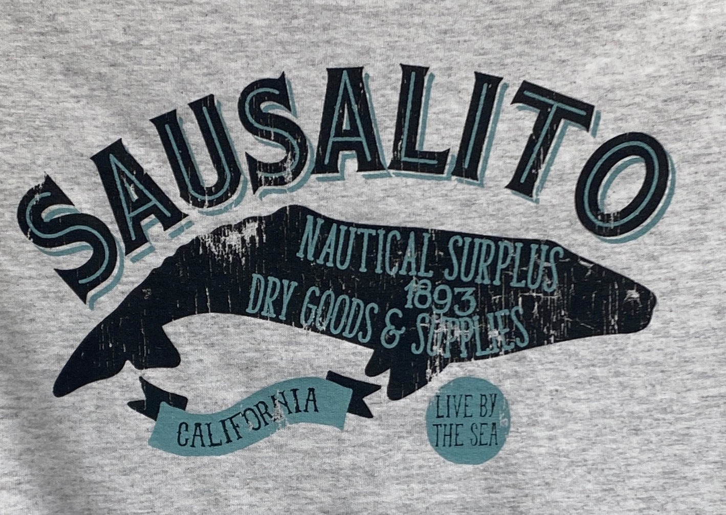 Sausalito Nautical Surplus t-shirt design with fish silhouette, est. 1893, featuring California and "Live by the Sea" text