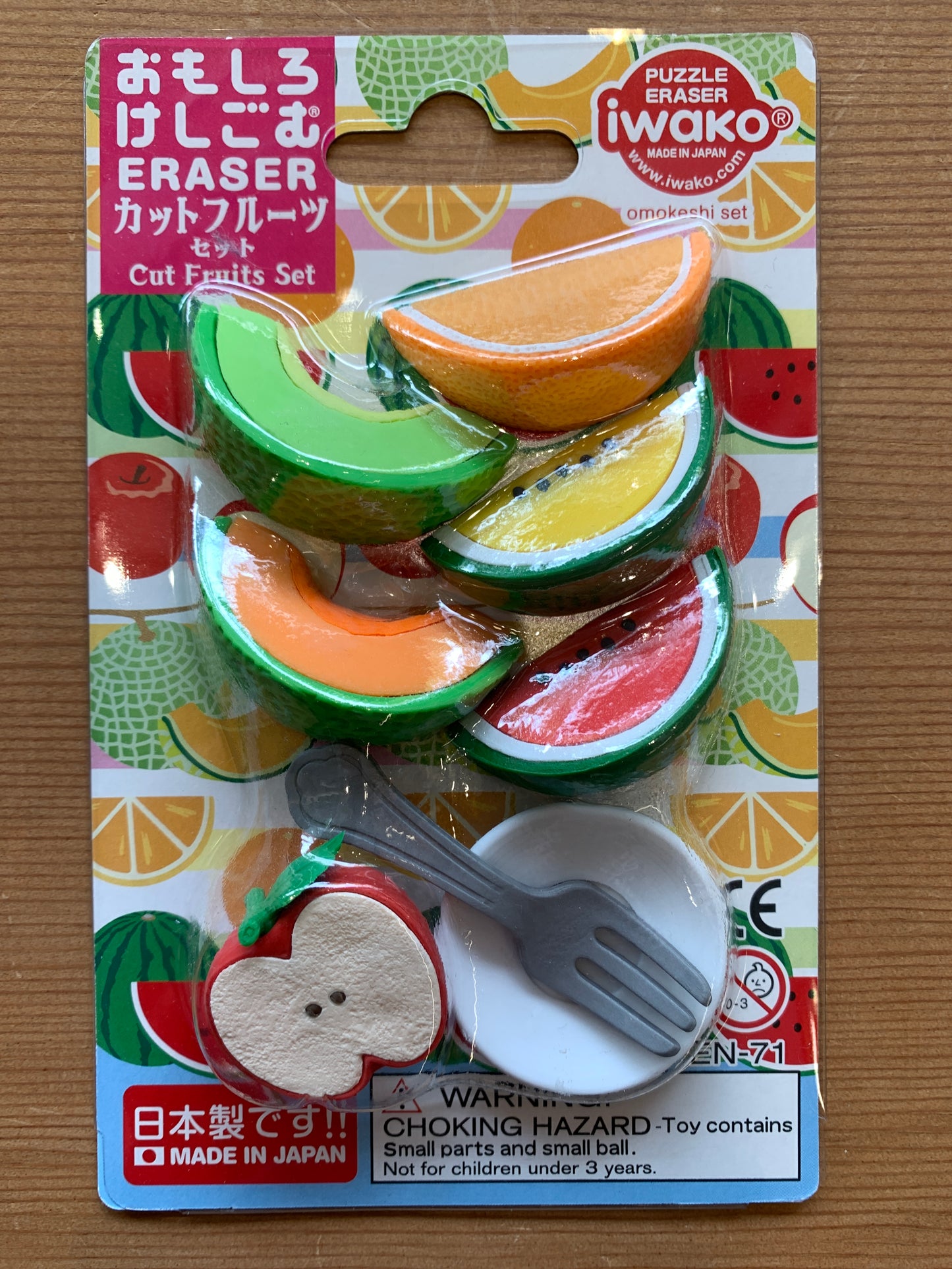 Japanese Cut Fruits eraser set with colorful sliced fruit erasers, apple, plate and utensil, packaged on fruit-patterned card