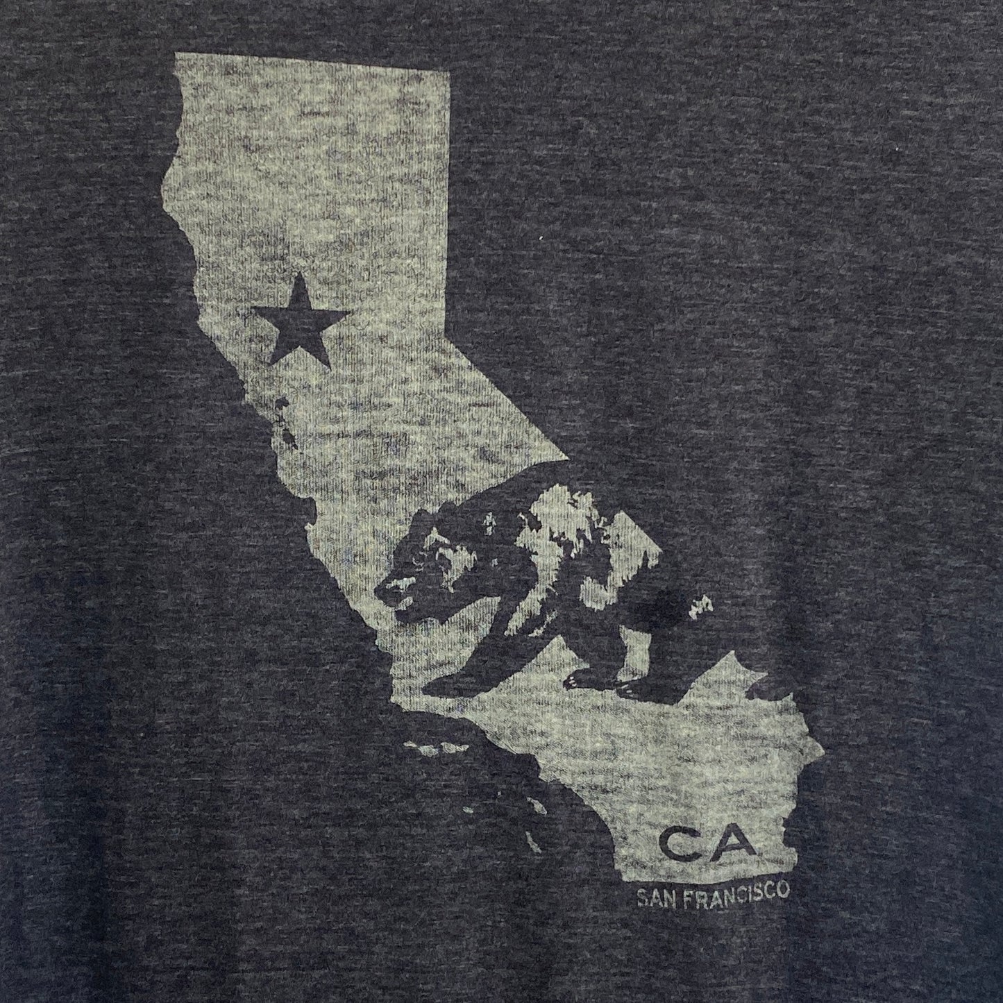 Black unisex t-shirt featuring California state outline with bear silhouette, star, and San Francisco text