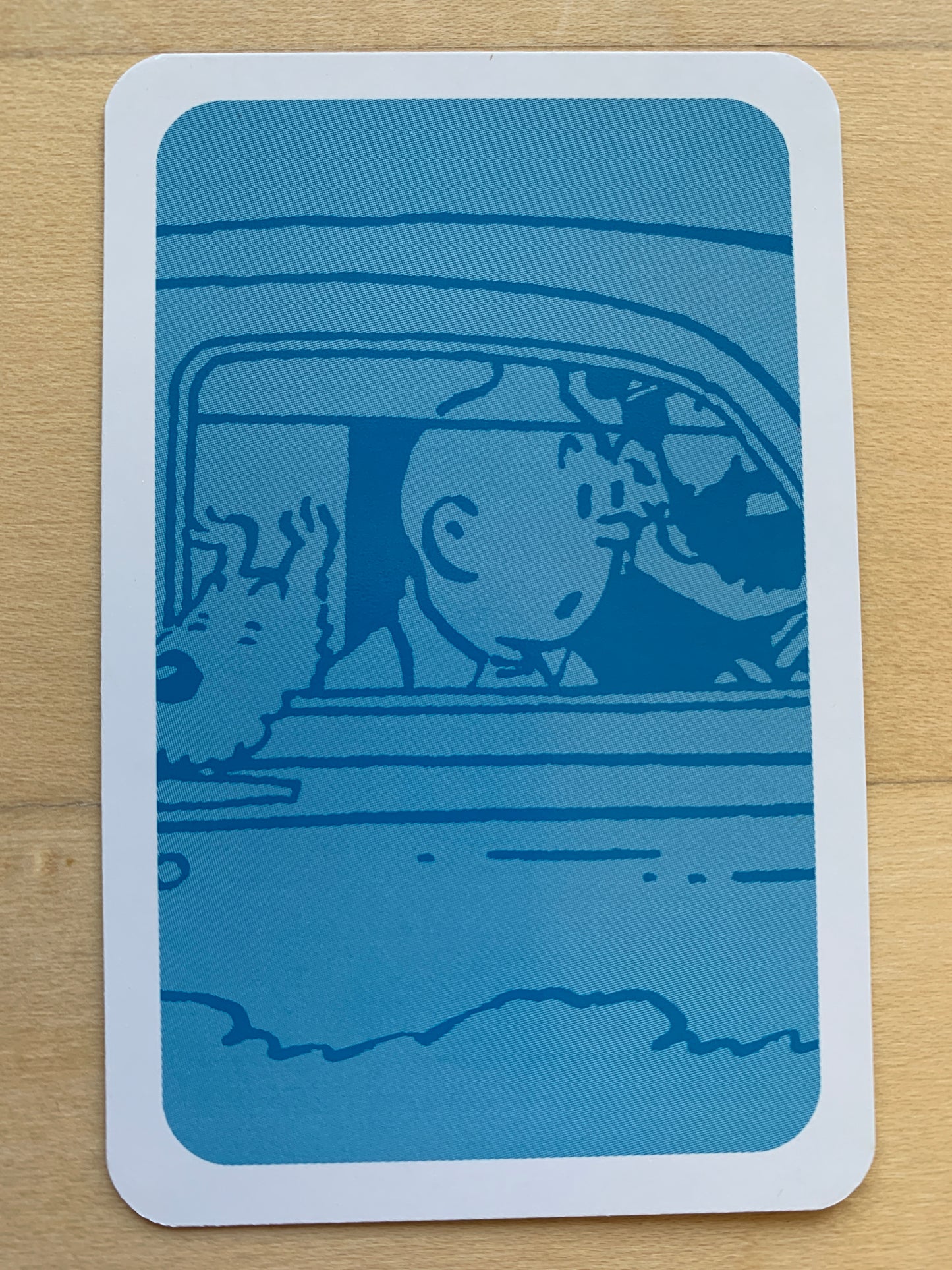 Tintin Cars playing card featuring blue illustration of cartoon characters in a vehicle from the Adventures of Tintin series