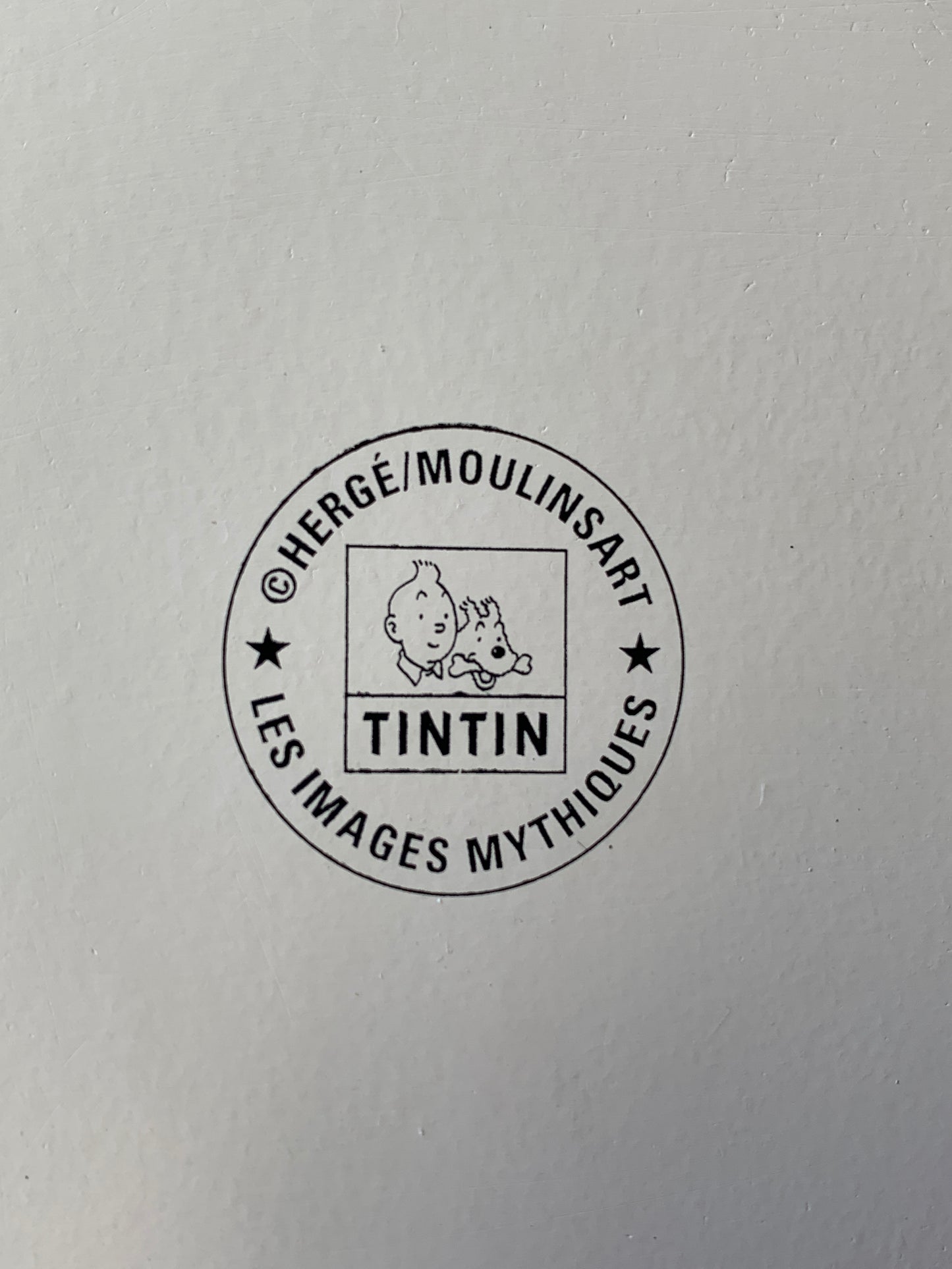 Official Tintin logo stamp for Hergé/Moulinsart collectibles, featuring iconic Tintin and Snowy characters