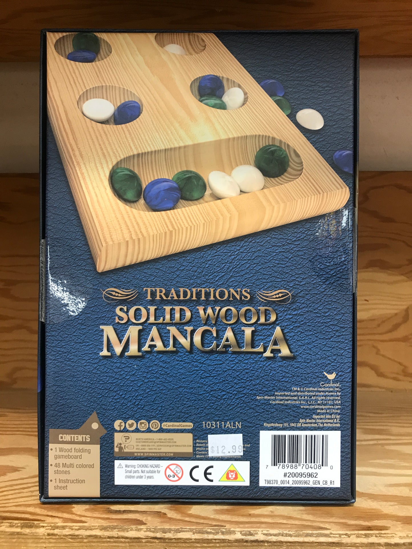 Traditions Solid Wood Mancala game box with wooden board and colorful stones, showcasing classic strategy game for all ages