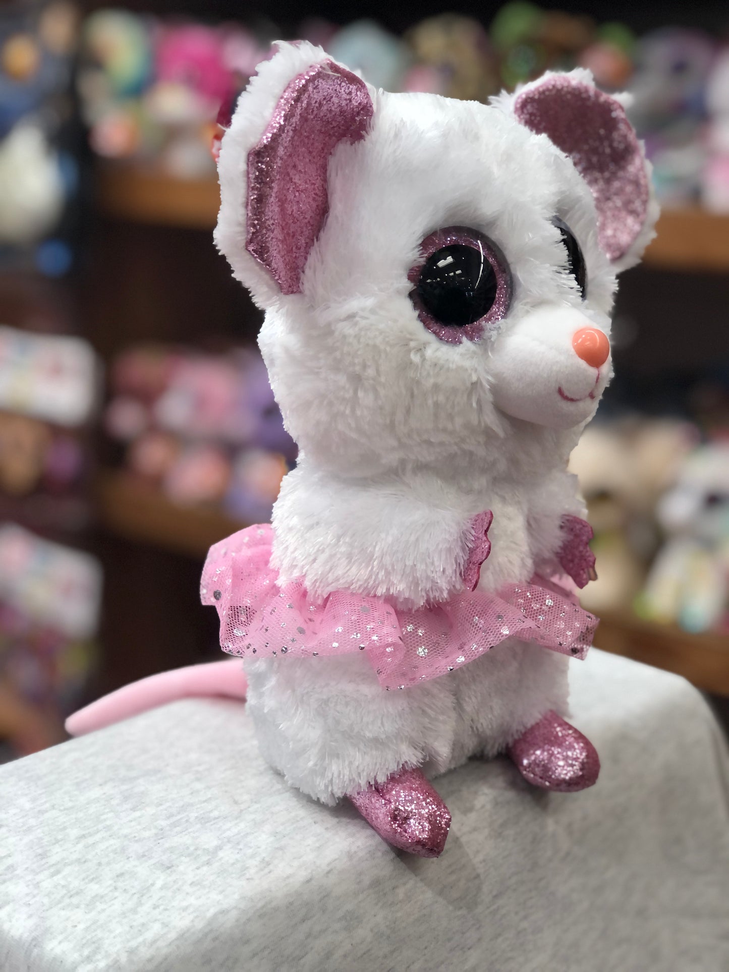Ty Beanie Boo Nina white ballerina mouse plush with pink sparkly tutu and large glittery eyes, ready for dance and hugs