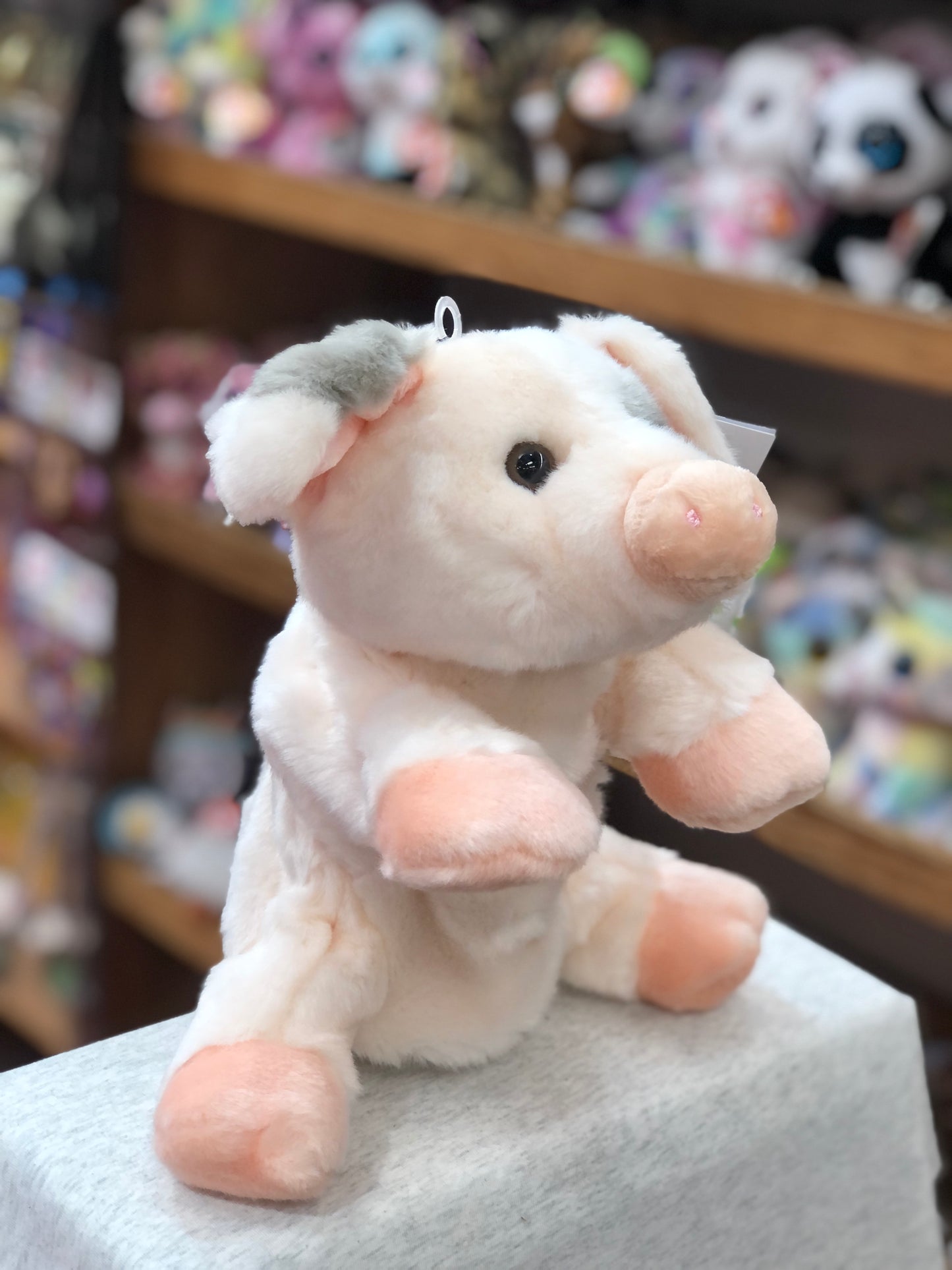 Cuddly full-bodied pig puppet from The Puppet Company, soft pink plush toy with expressive features, suitable for ages 1+
