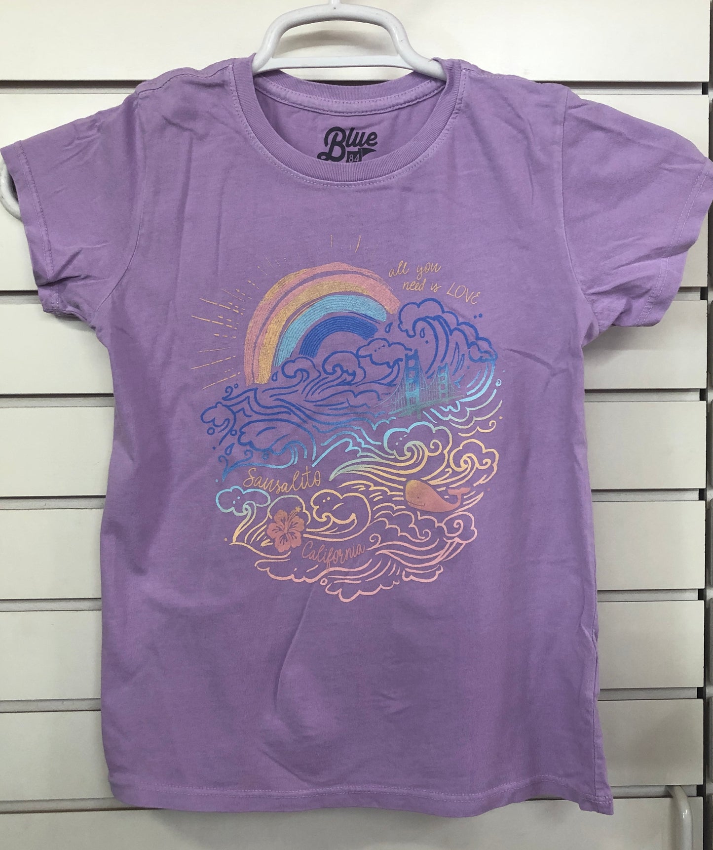 Purple Sausalito kids' t-shirt with colorful Golden Gate Bridge, rainbow, waves design and "All you need is love" text