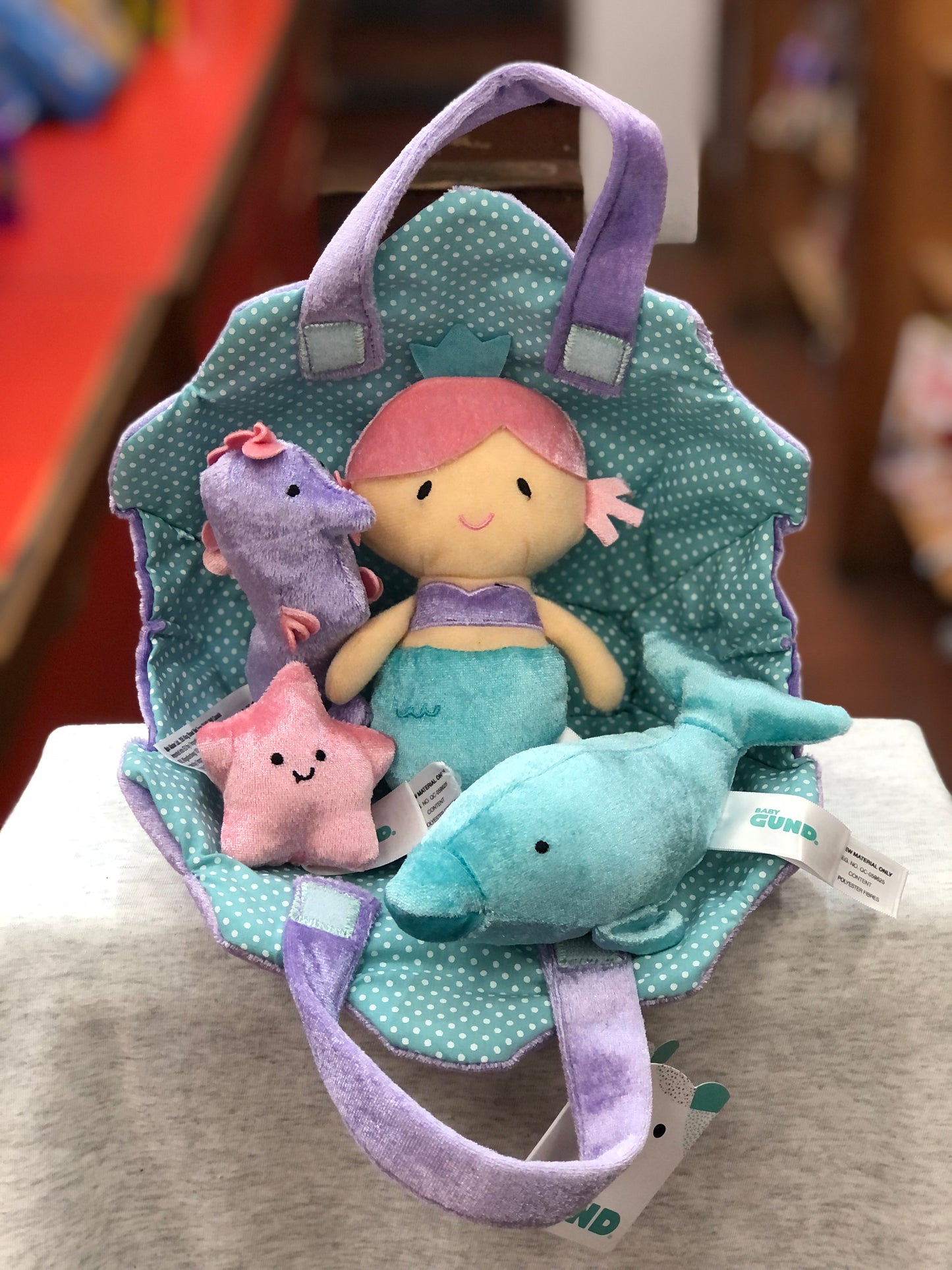 Baby Gund Mermaid Adventure Playset with plush mermaid, dolphin, seahorse, starfish in polka dot carrier, soft nautical toys for infants